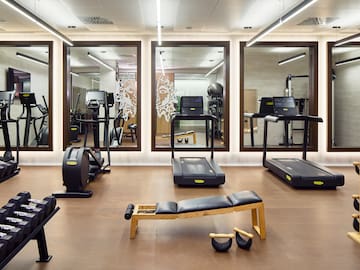 a room with treadmills and exercise equipment