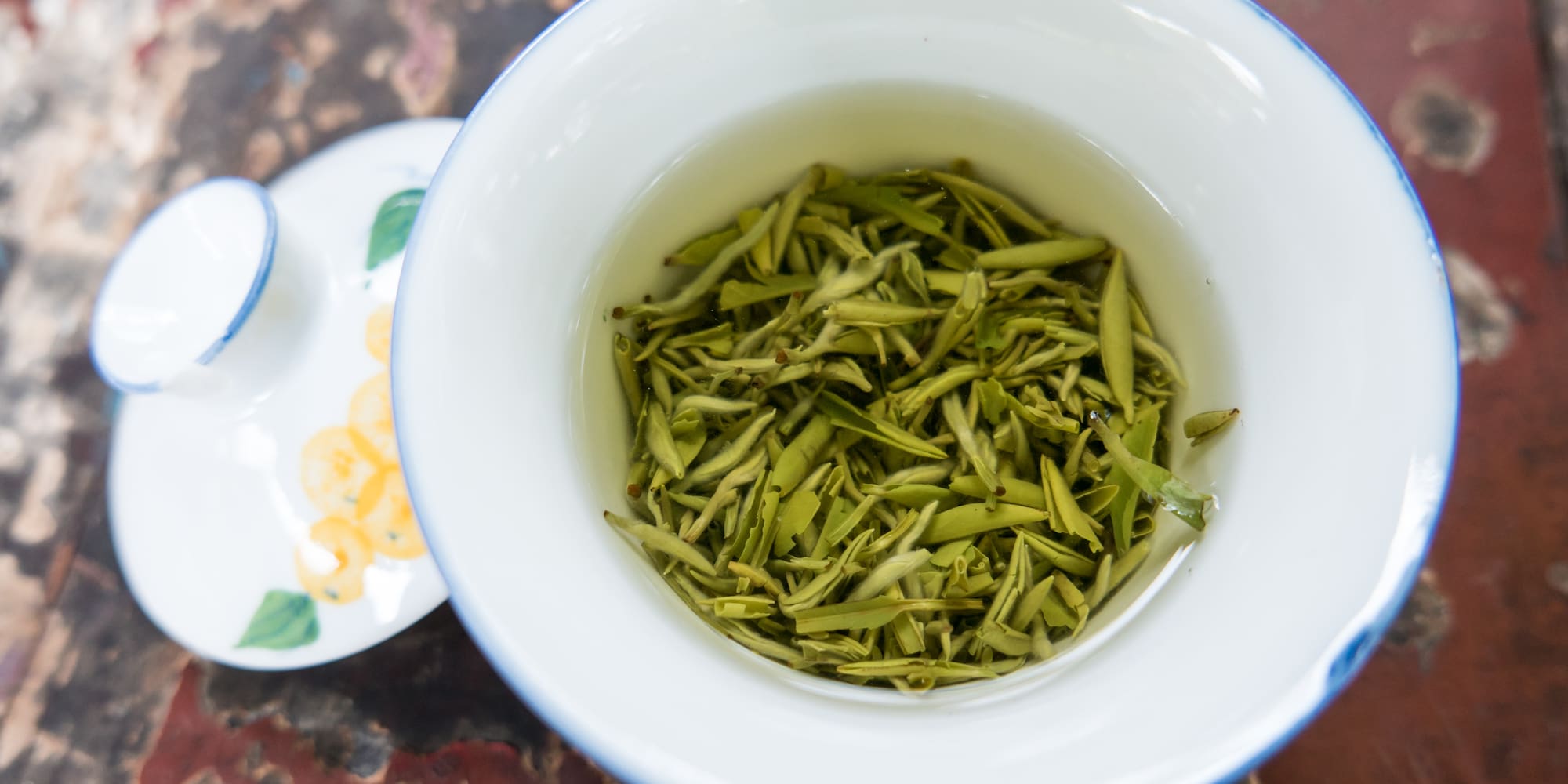 a bowl of green tea leaves