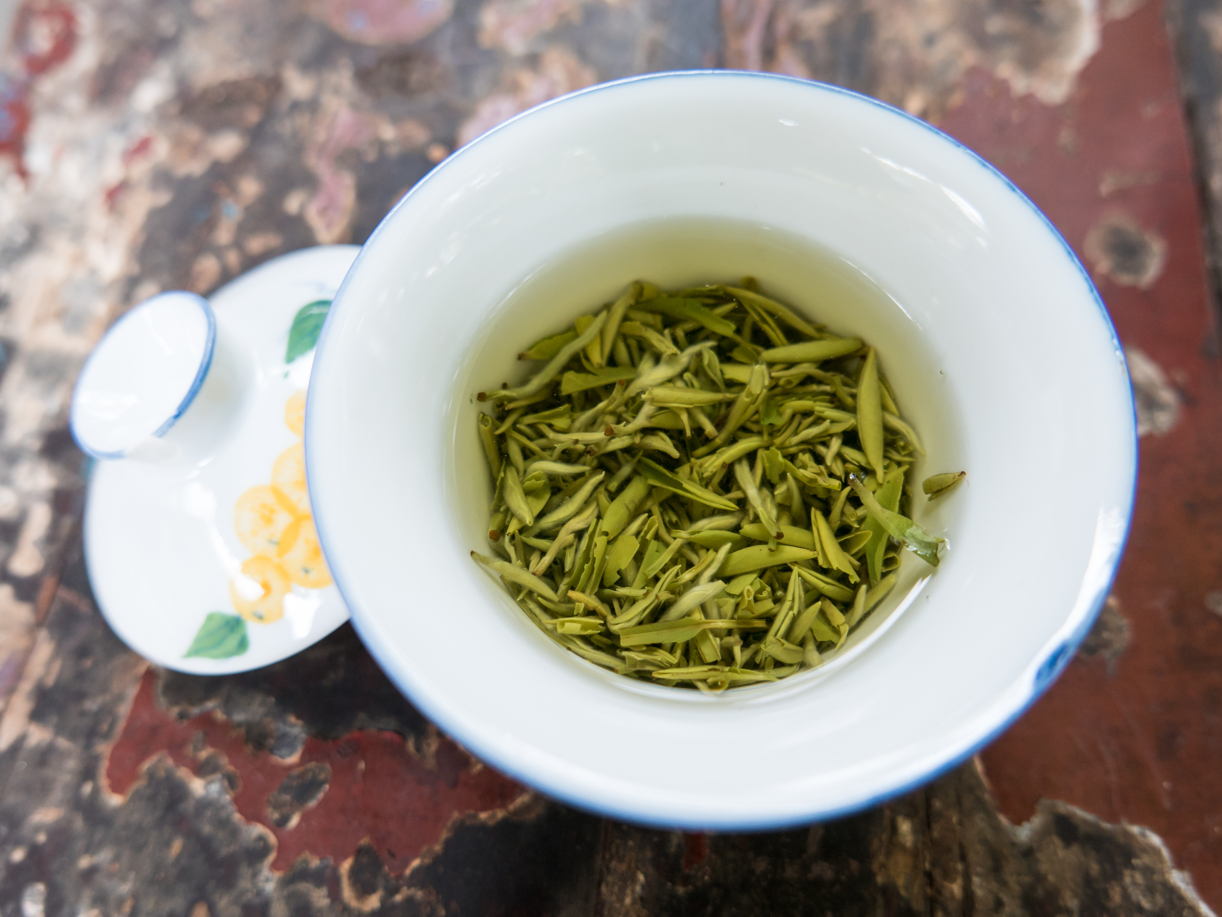 a bowl of green tea leaves