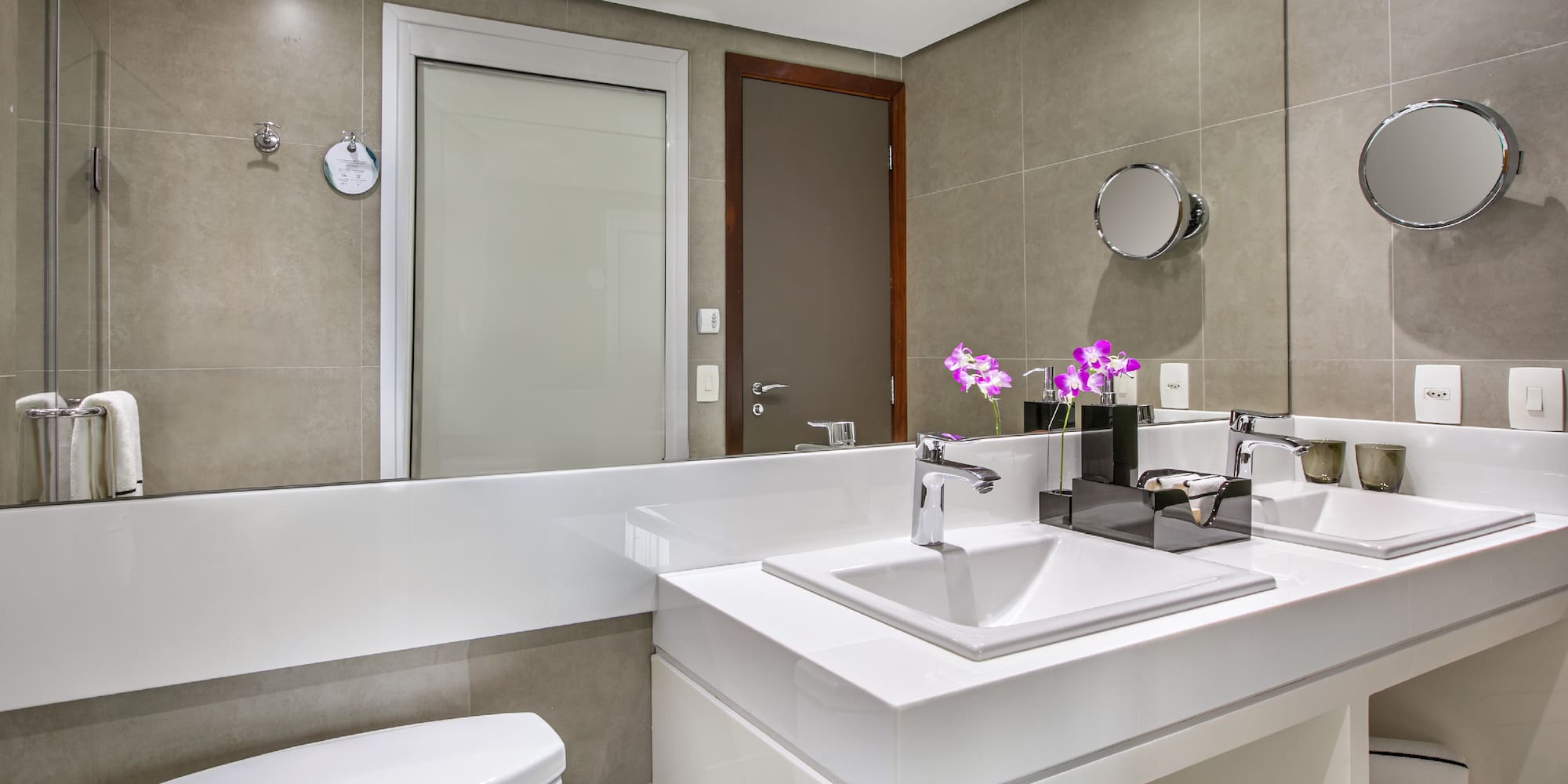 a bathroom with a sink toilet and mirror