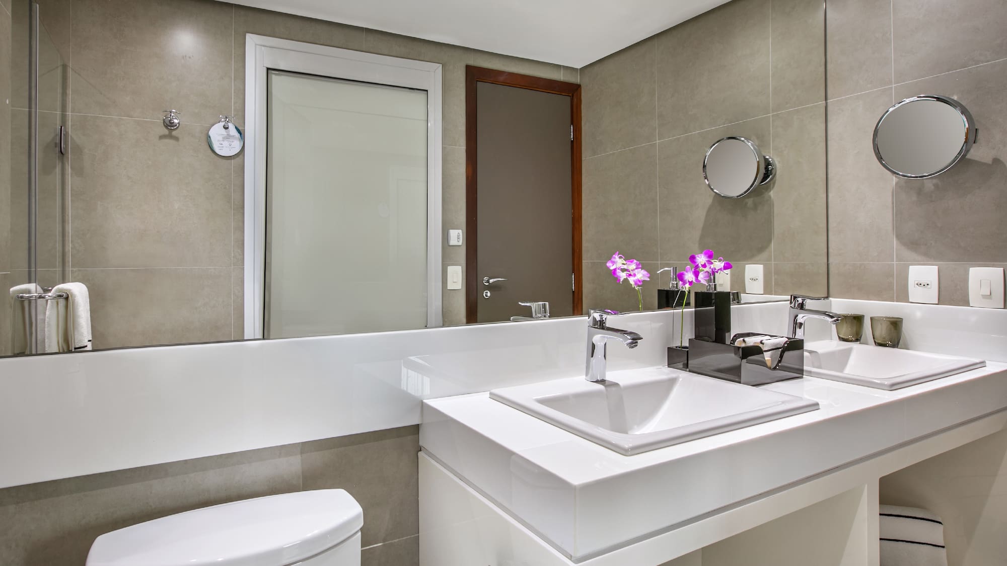 a bathroom with a sink toilet and mirror