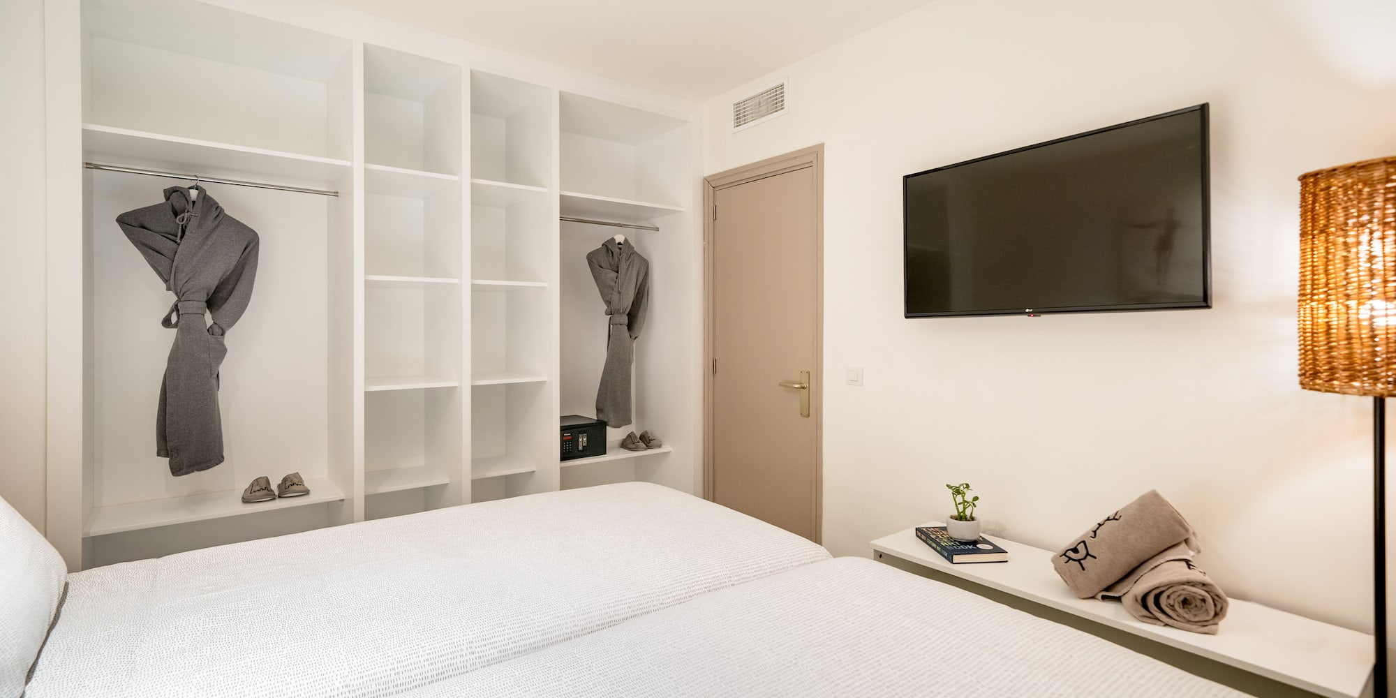 a room with a tv and a bed