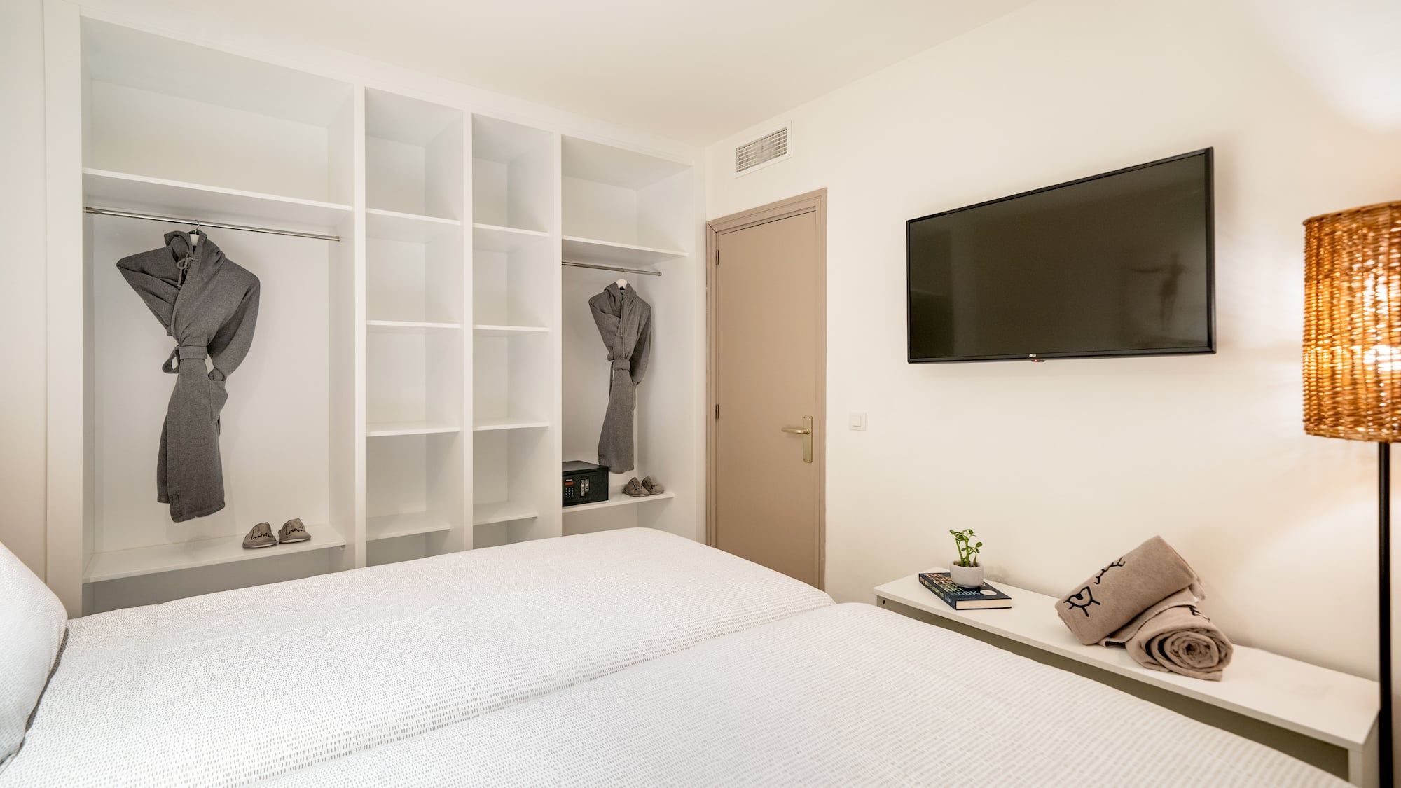 a room with a tv and a bed