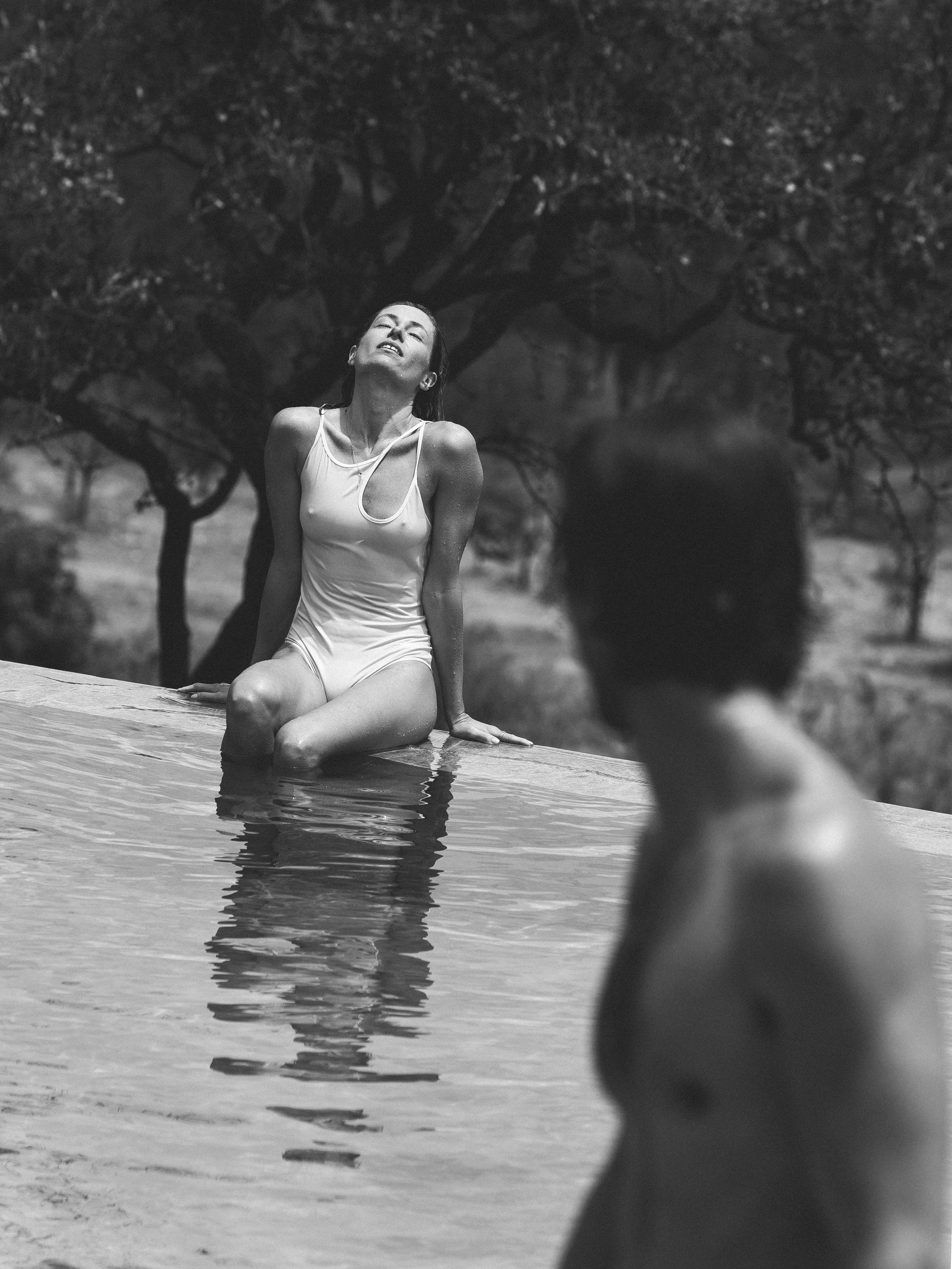 a woman sitting in a pool