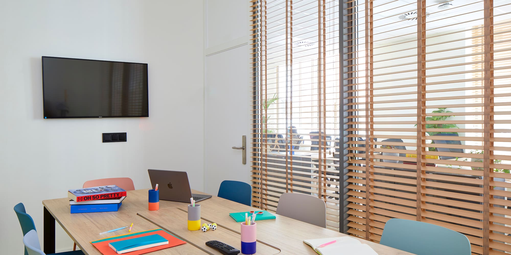 a table with laptops and notebooks on it