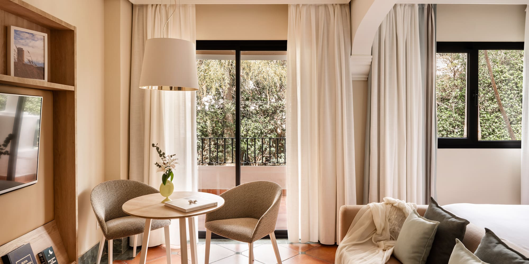 a living room with a table and chairs