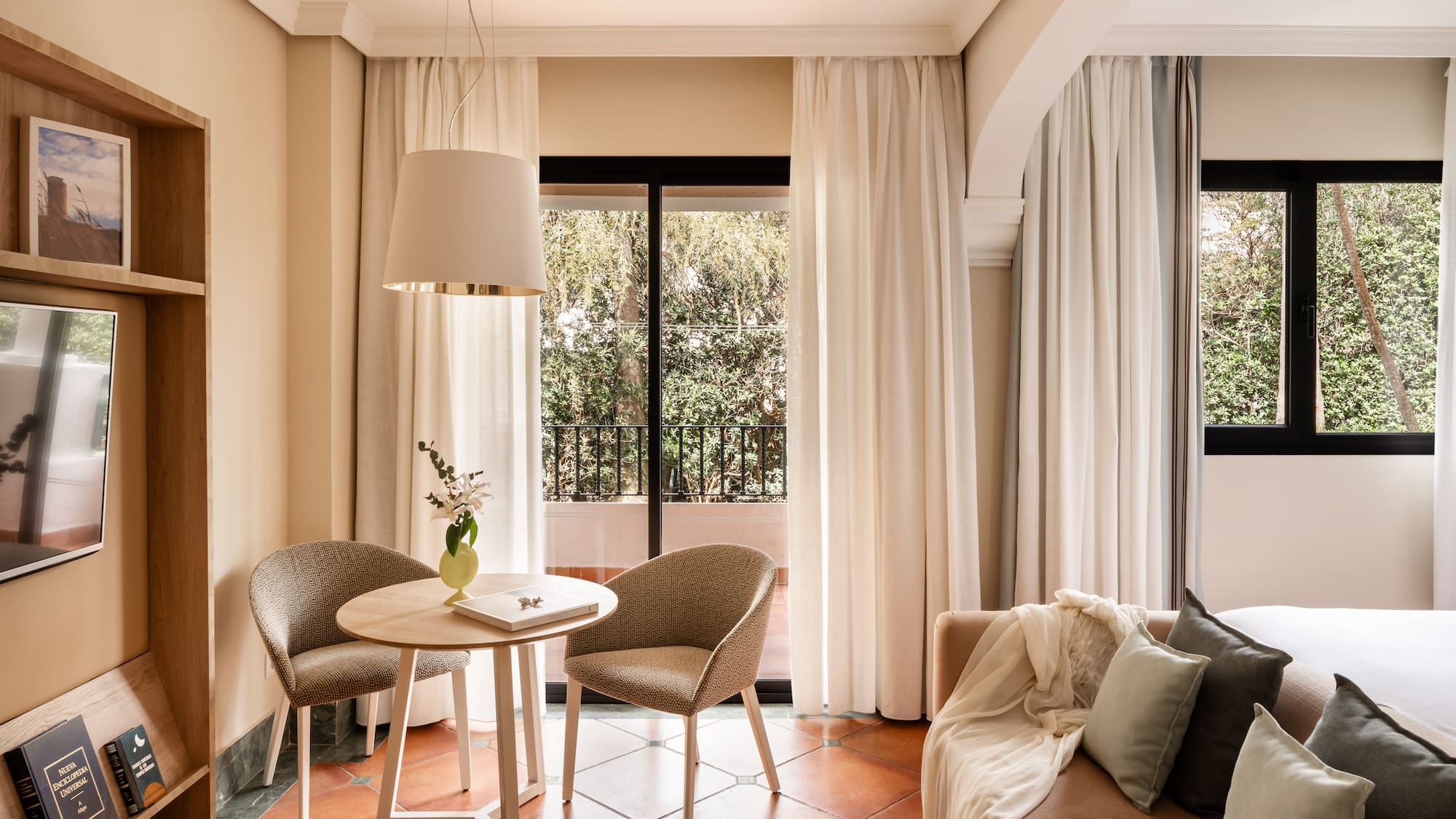 a living room with a table and chairs