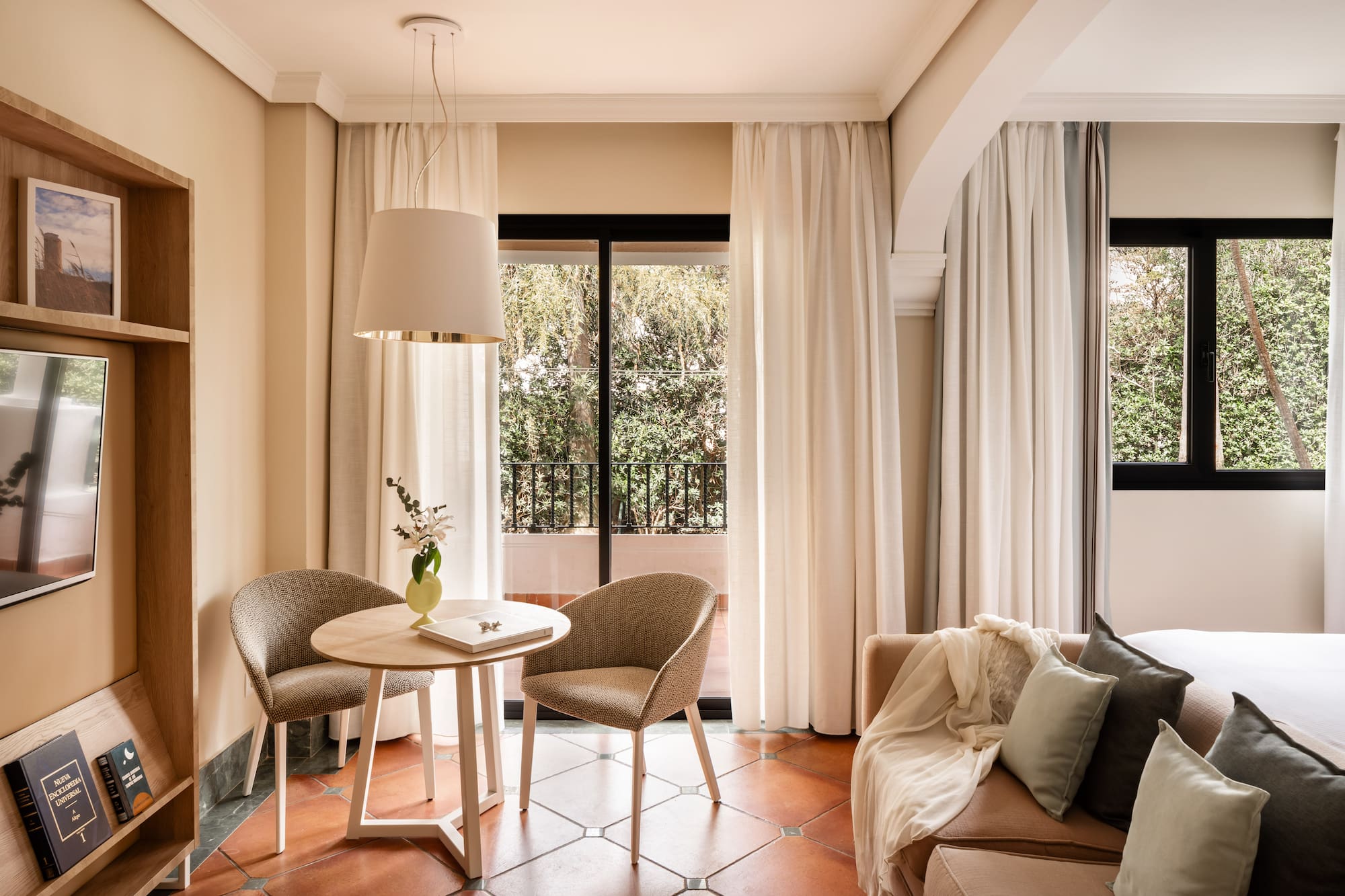 a living room with a table and chairs