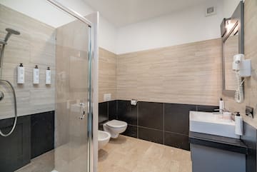 a bathroom with a shower and toilet