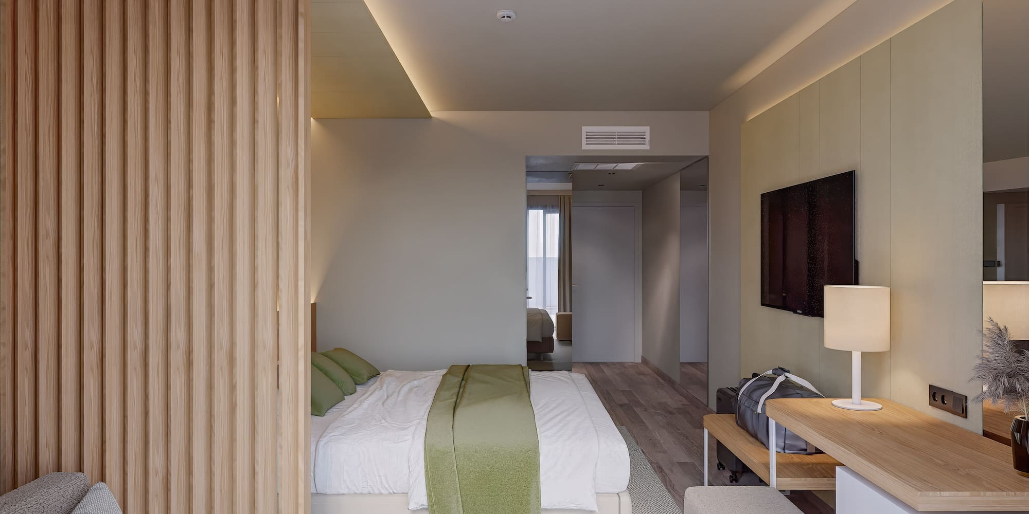 a bedroom with a bed and a tv