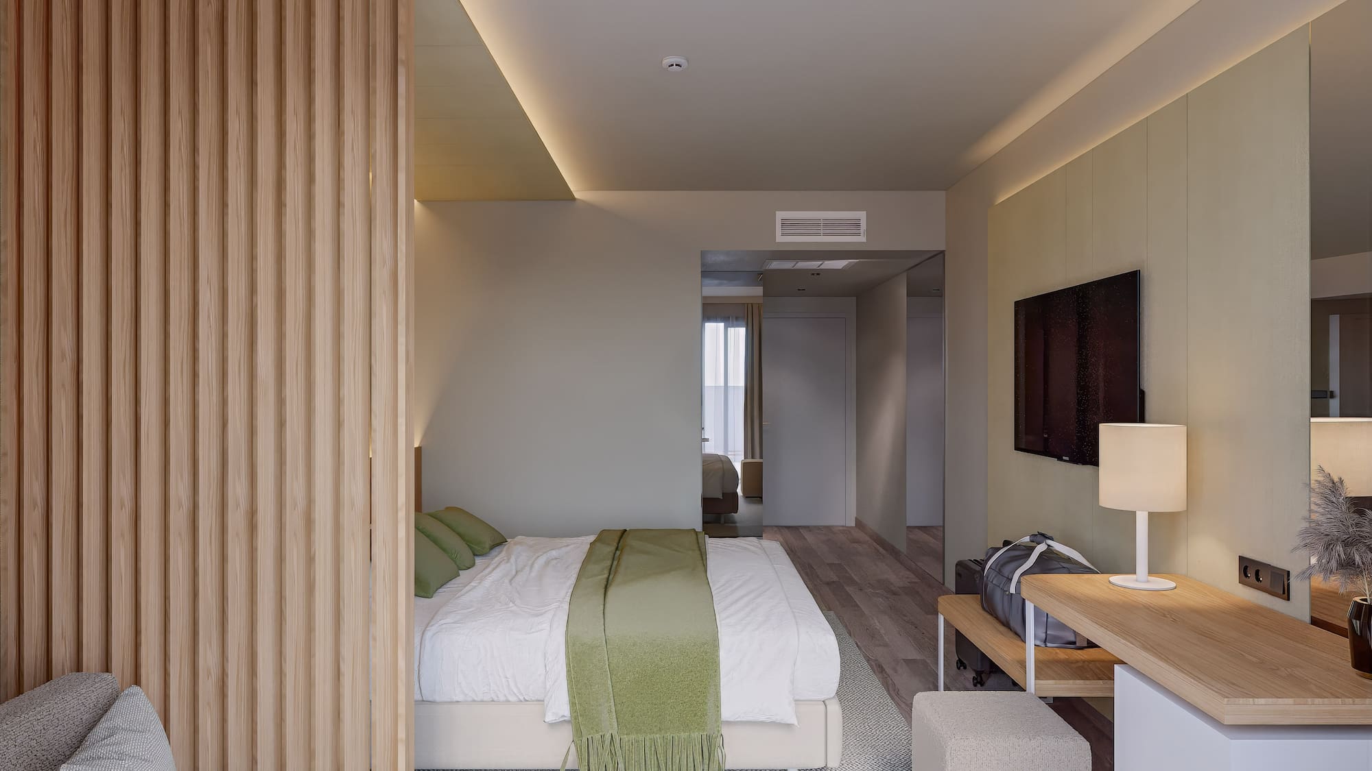 a bedroom with a bed and a tv