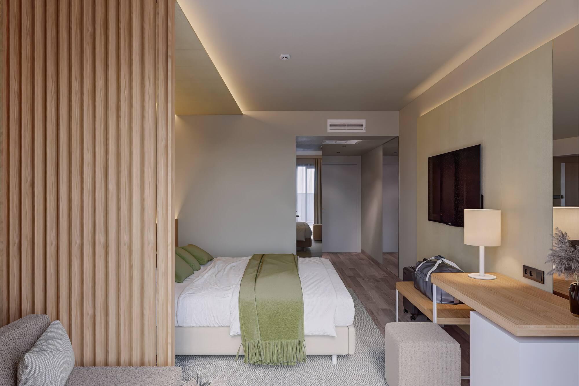 a bedroom with a bed and a tv