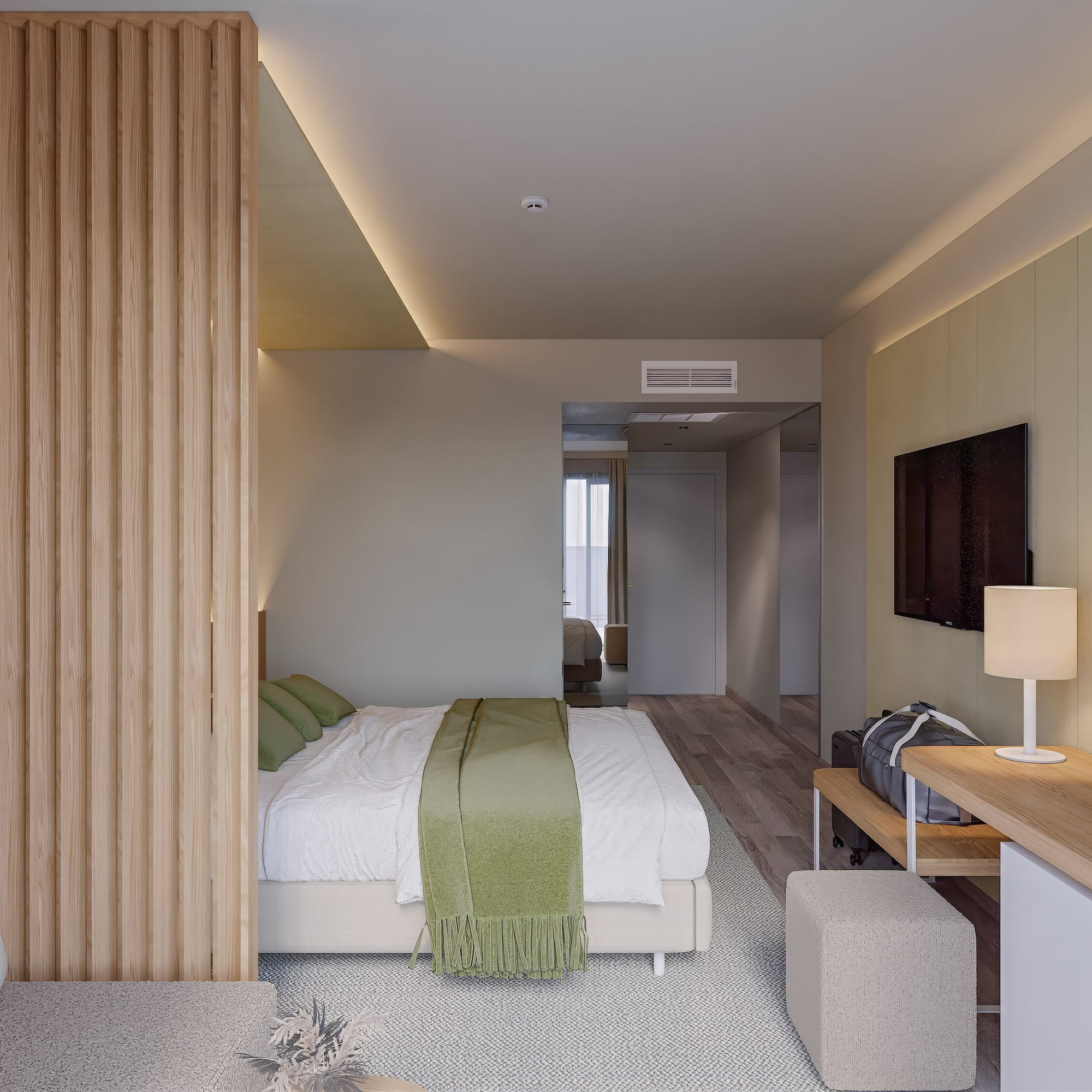 a bedroom with a bed and a tv