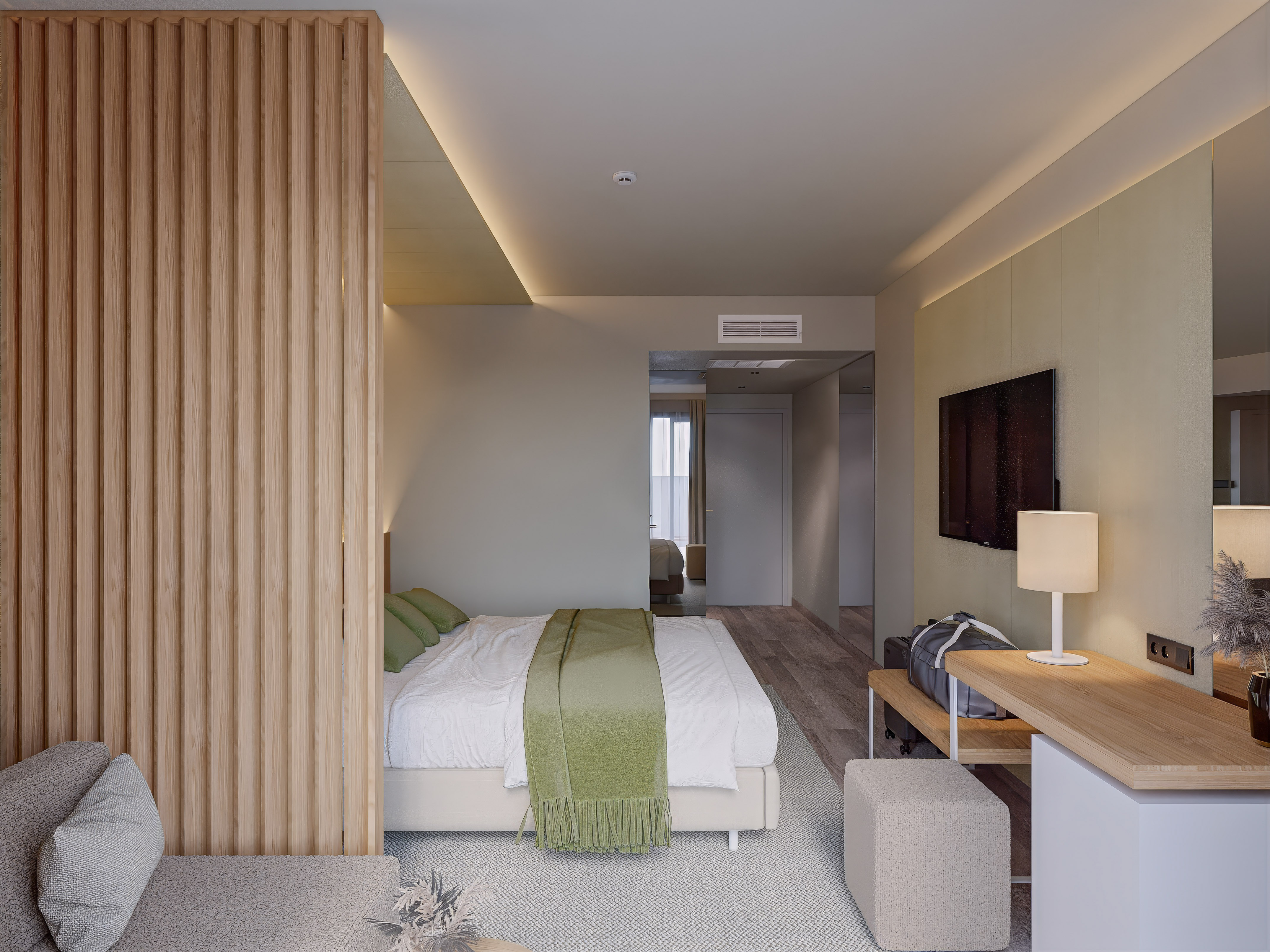 a bedroom with a bed and a tv