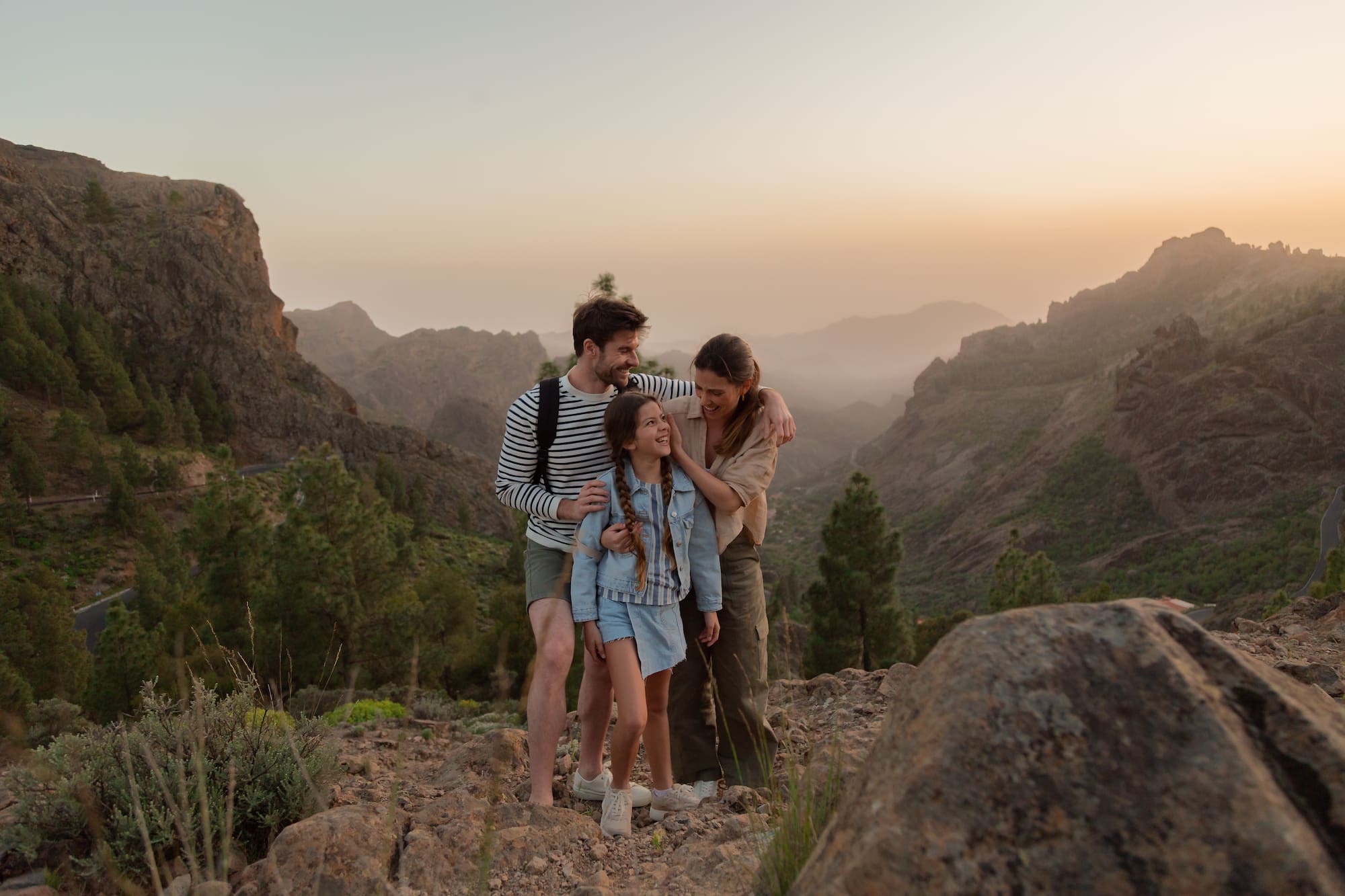 a group of people standing on a mountain
