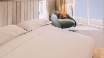 a bed and chair in a room