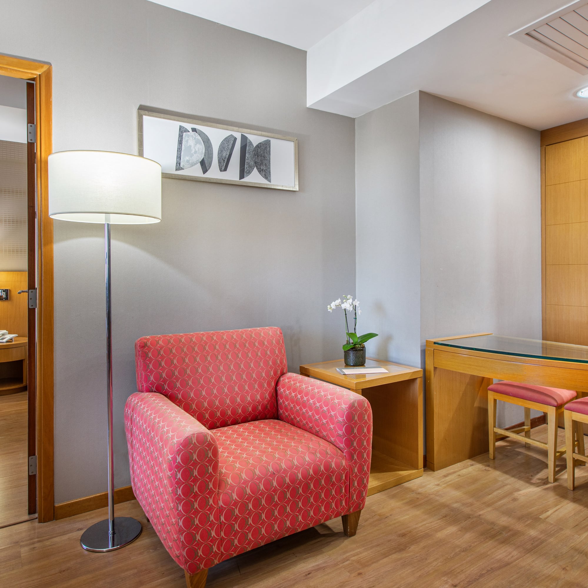 a room with a red chair and a table