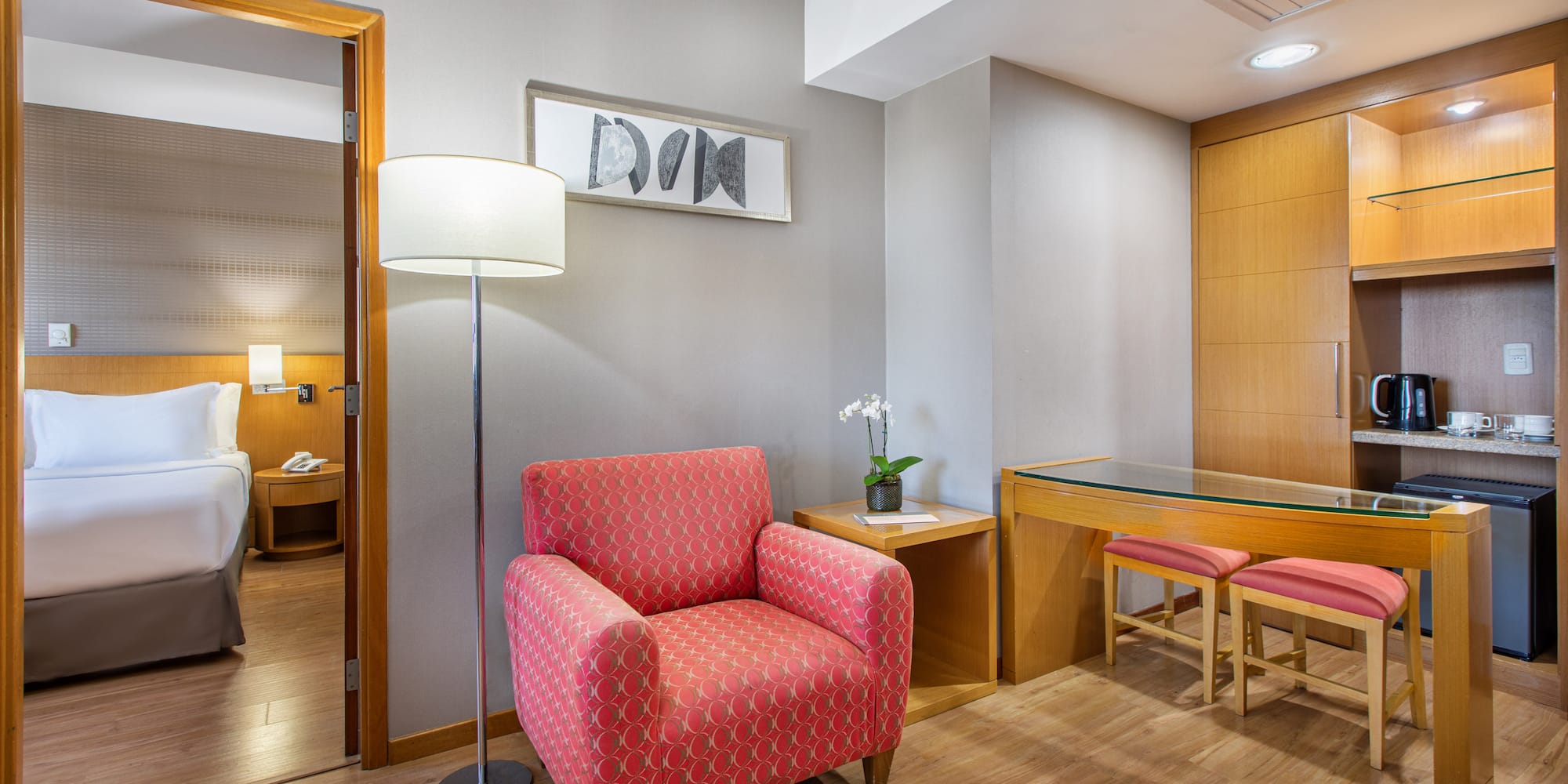 a room with a red chair and a table