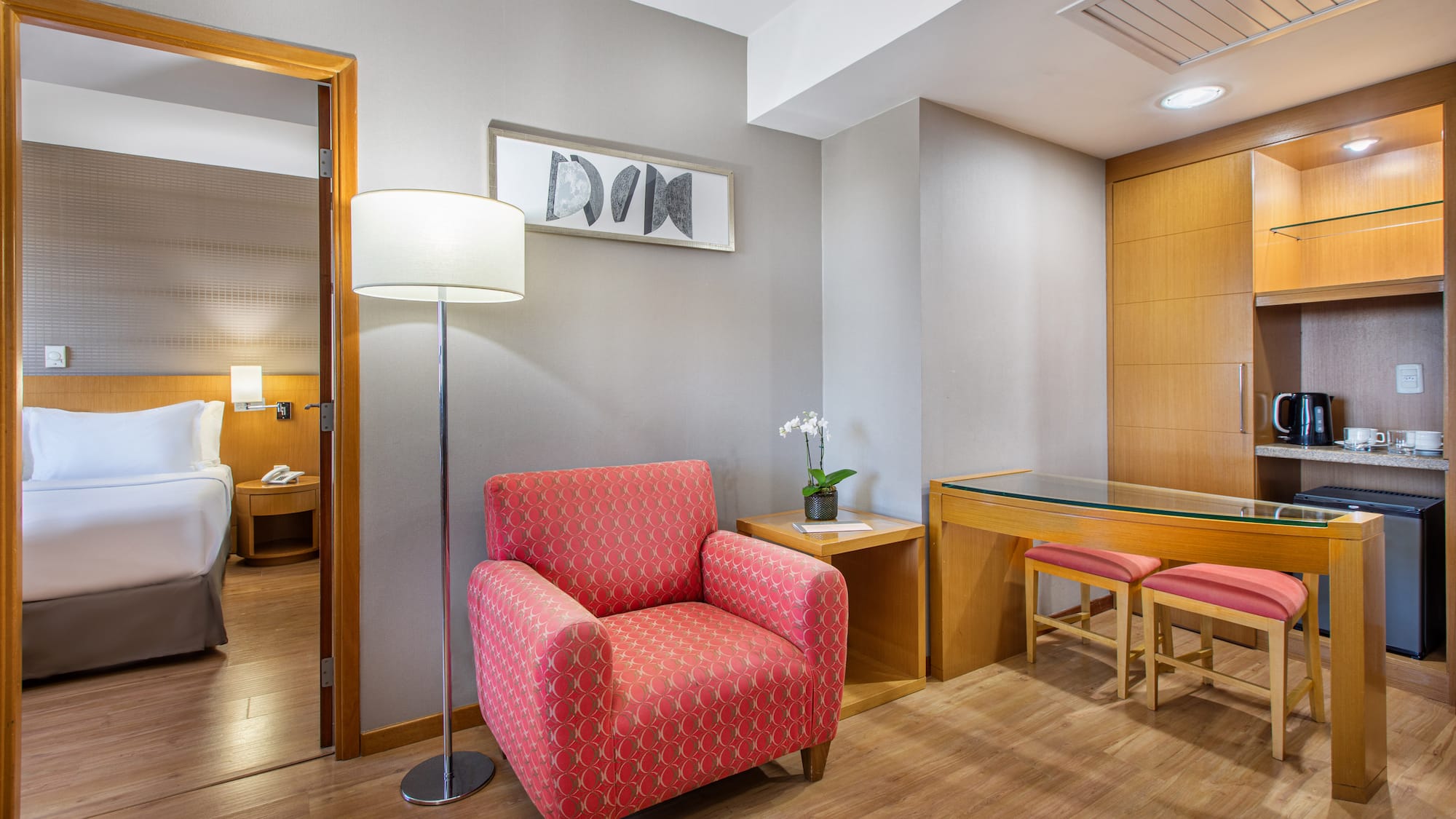 a room with a red chair and a table