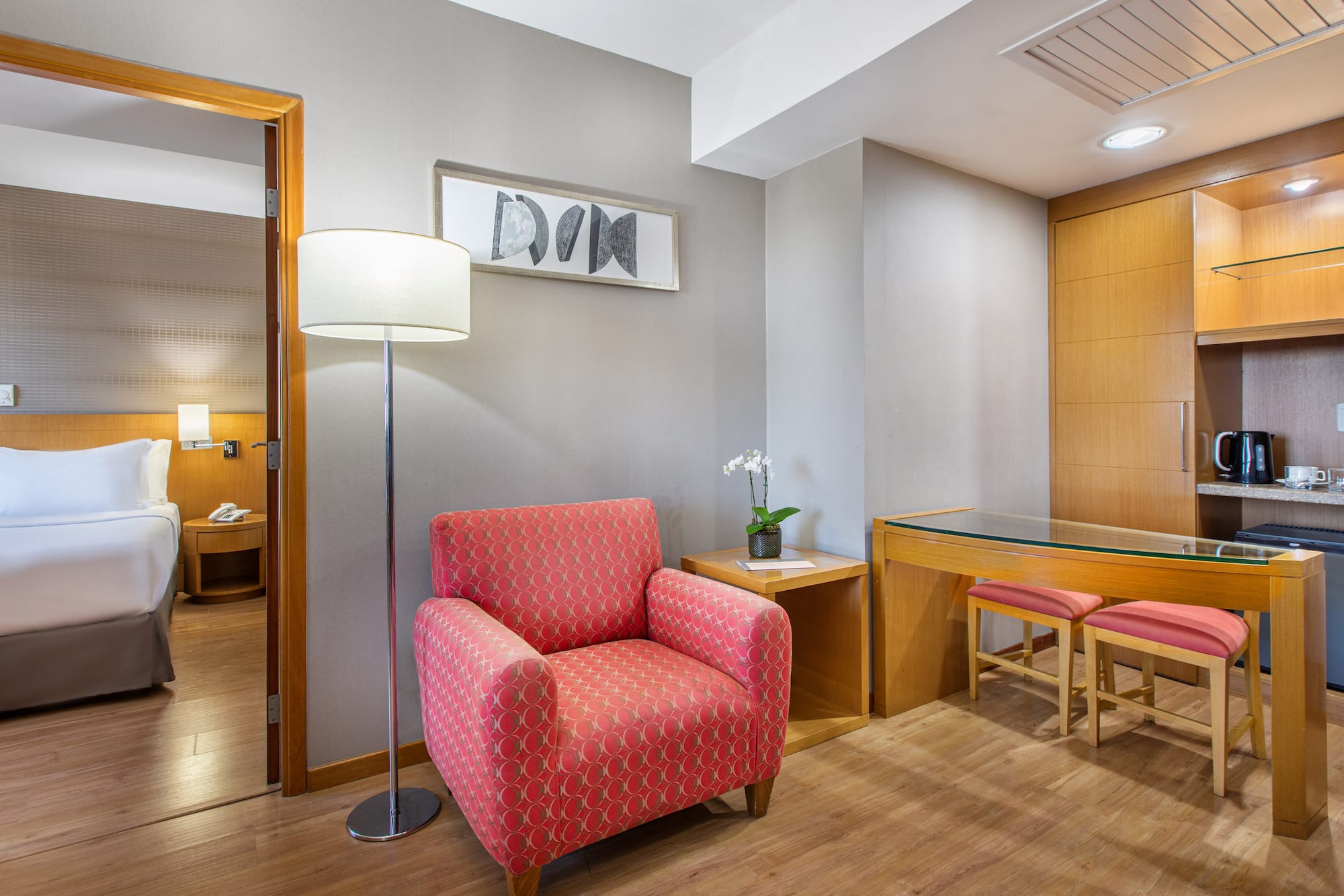 a room with a red chair and a table