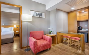 a room with a red chair and a table