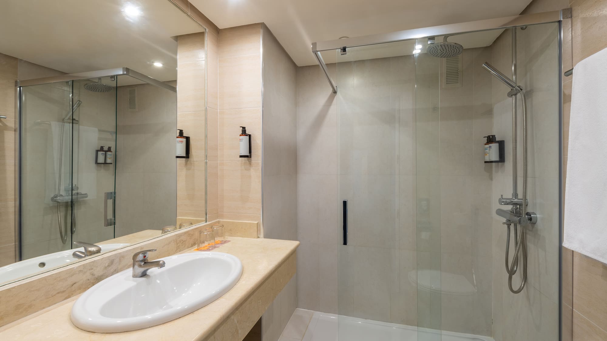 a bathroom with a shower and sink