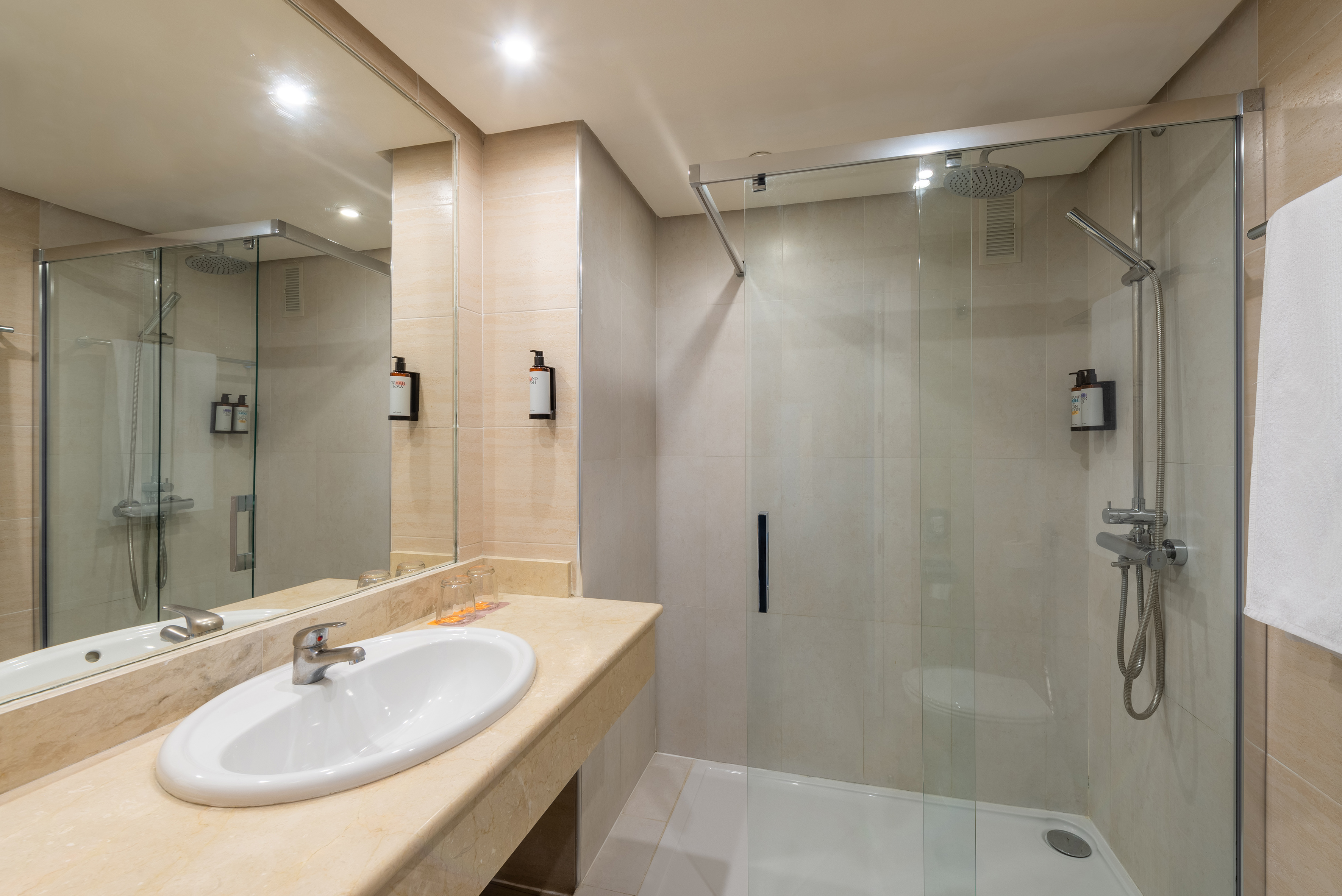 a bathroom with a shower and sink