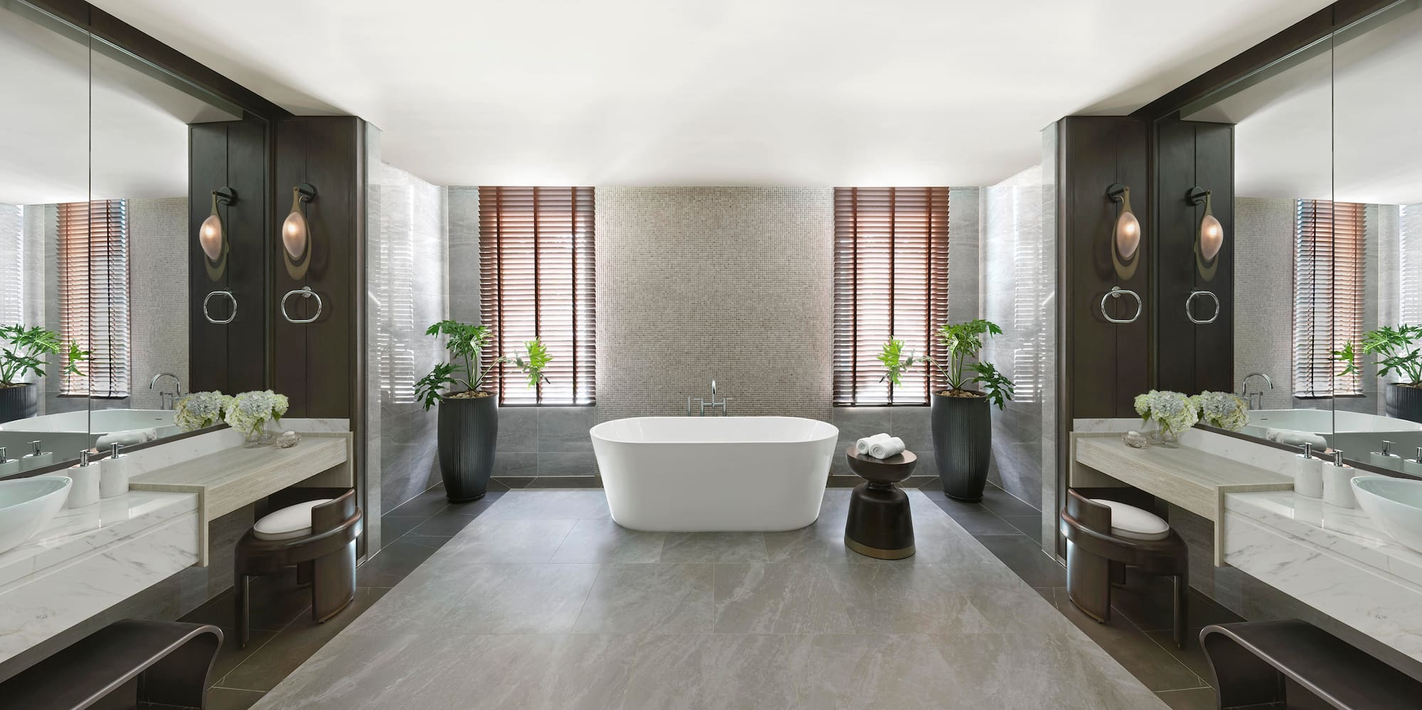 a bathroom with a tub and plants