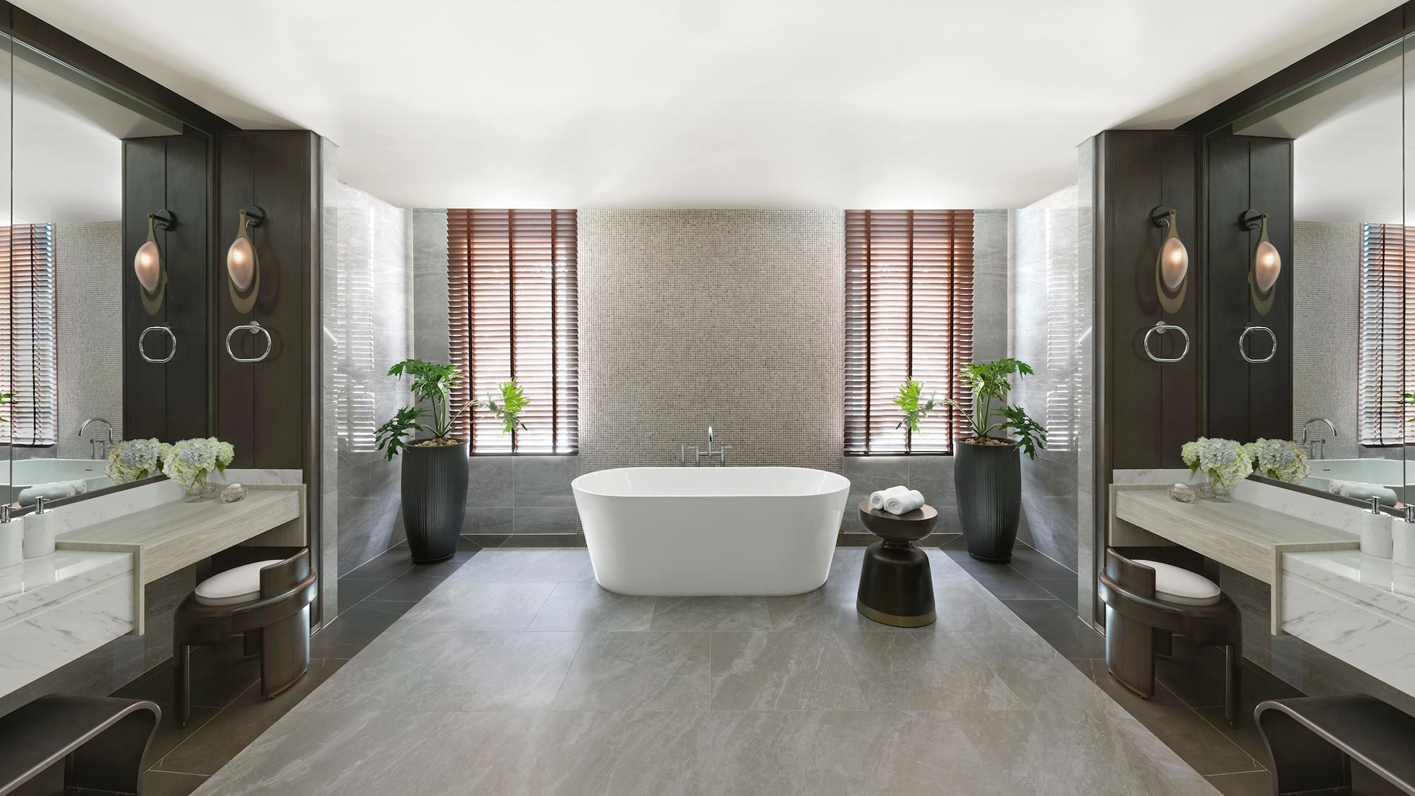 a bathroom with a tub and plants