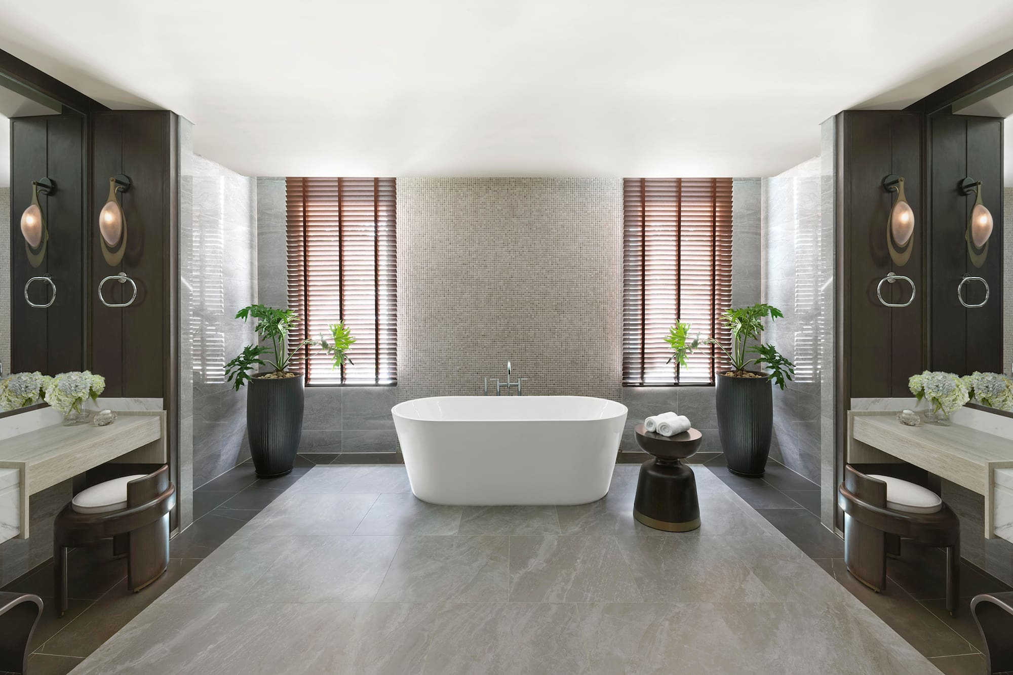 a bathroom with a tub and plants