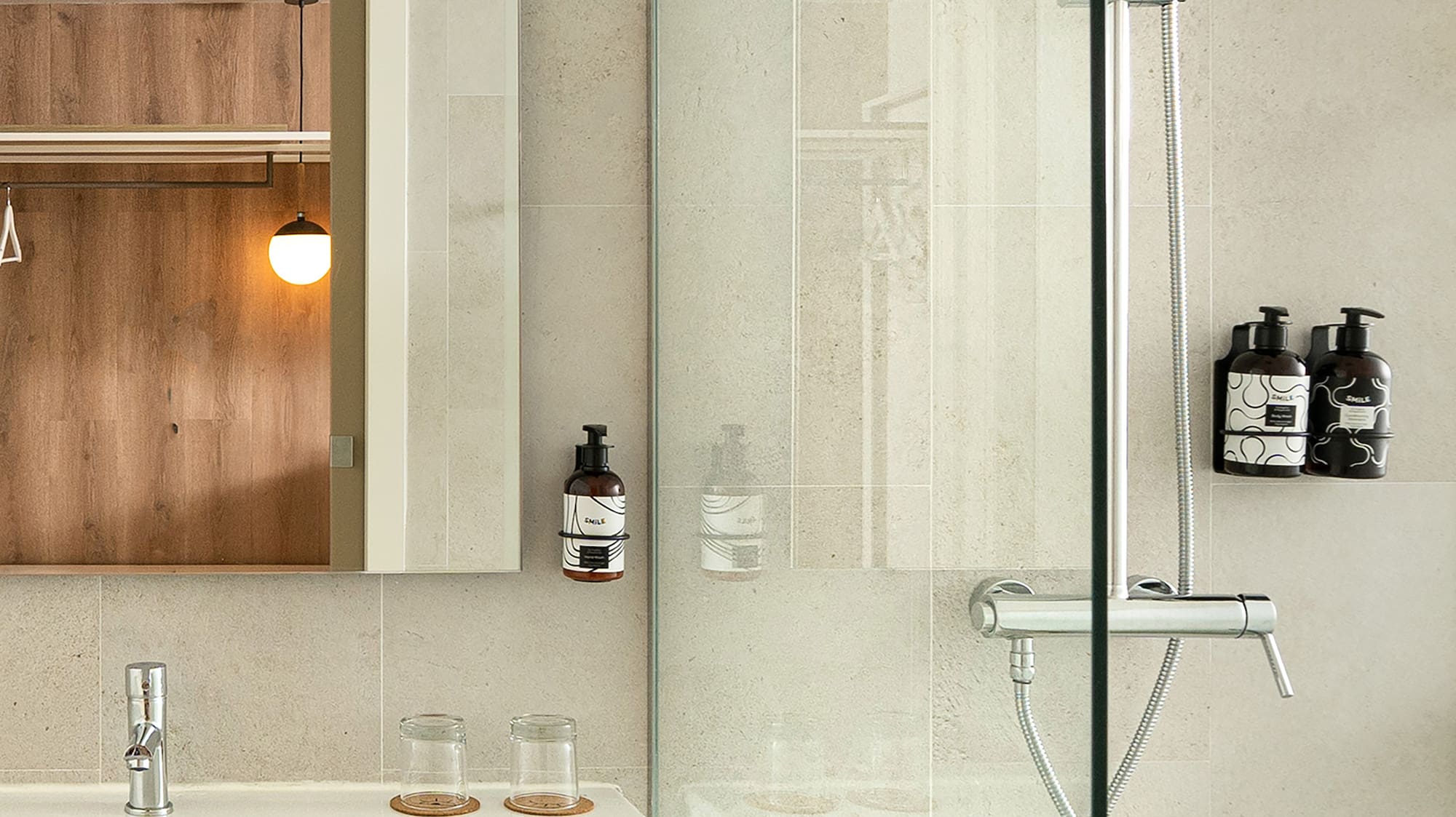 a bathroom with a glass shower door