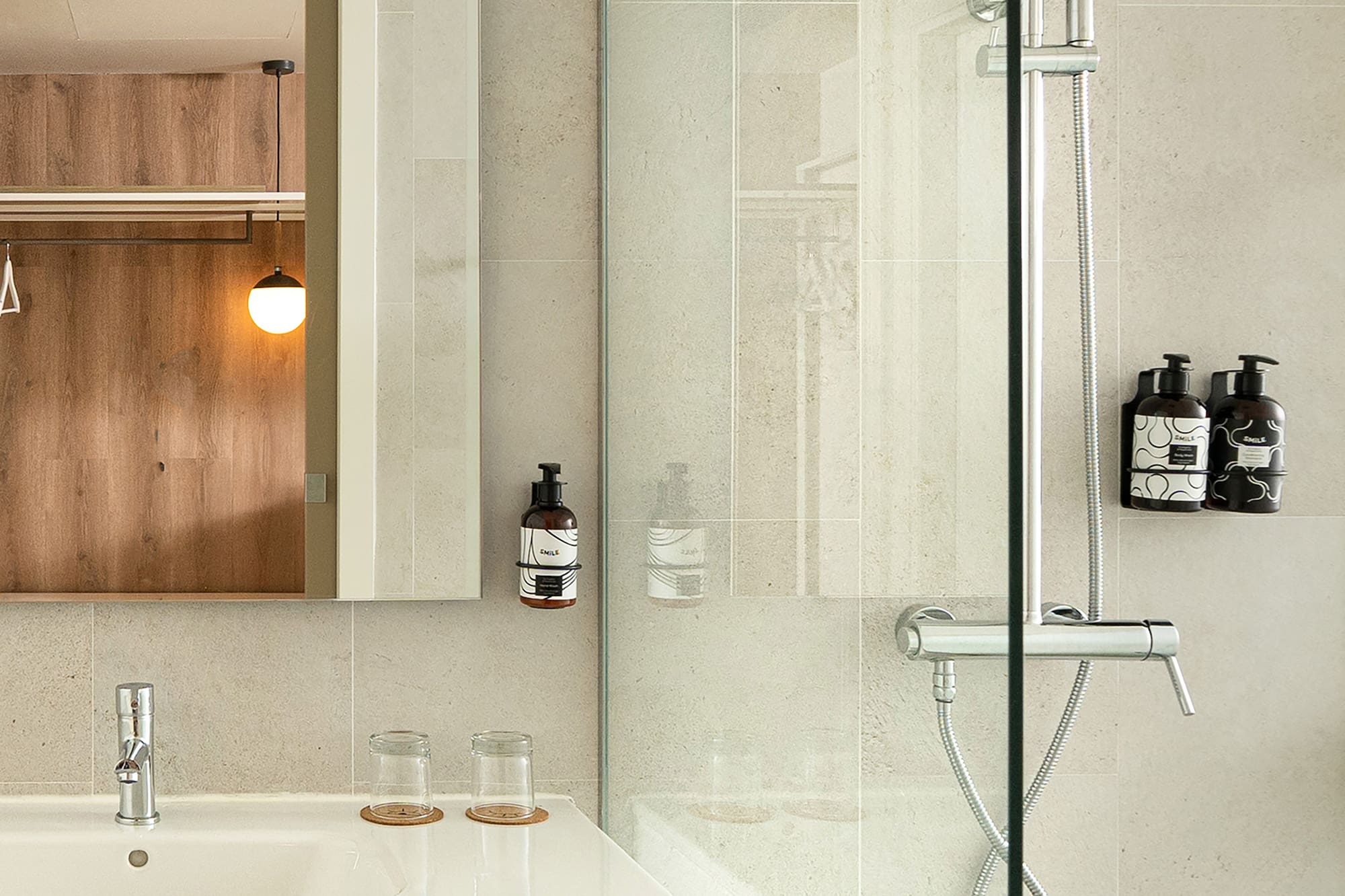 a bathroom with a glass shower door