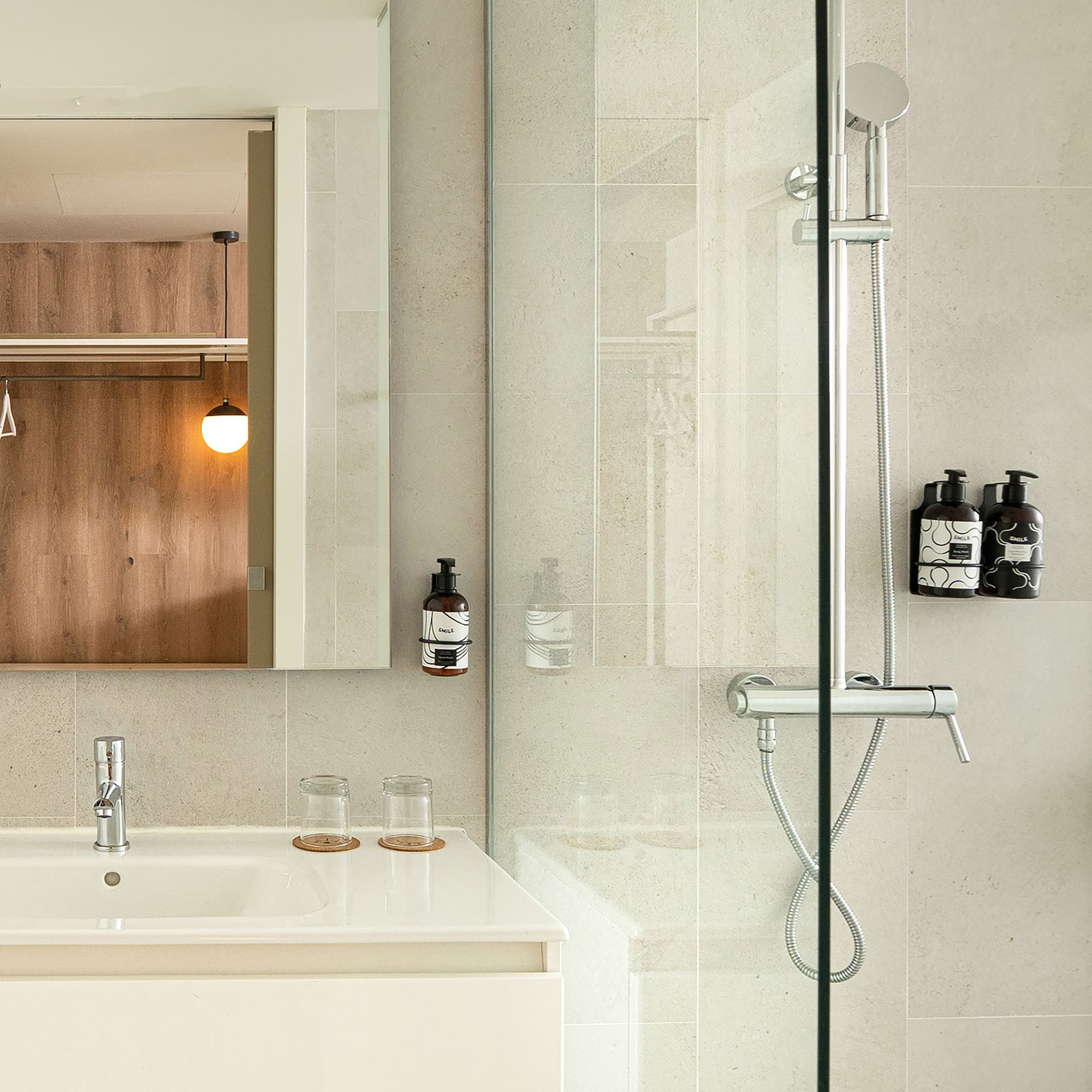 a bathroom with a glass shower door