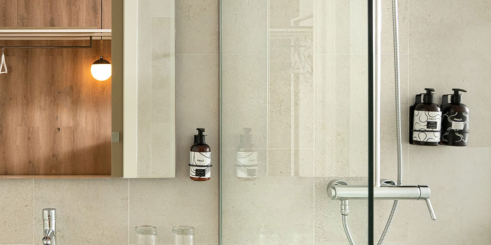 a bathroom with a glass shower door
