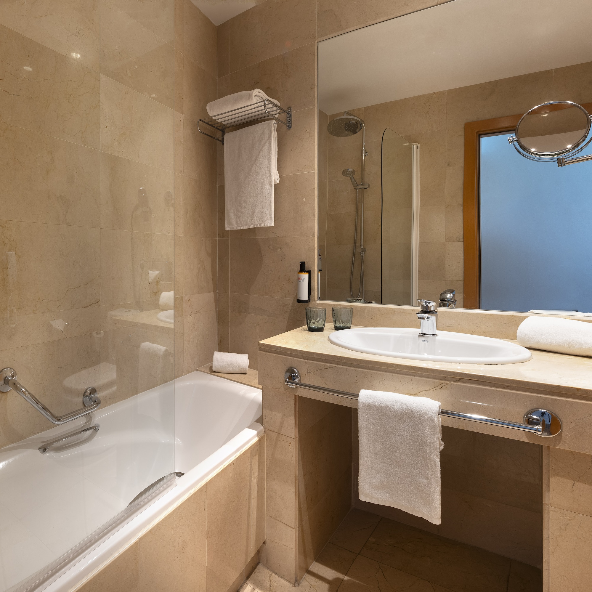 a bathroom with a bathtub and sink