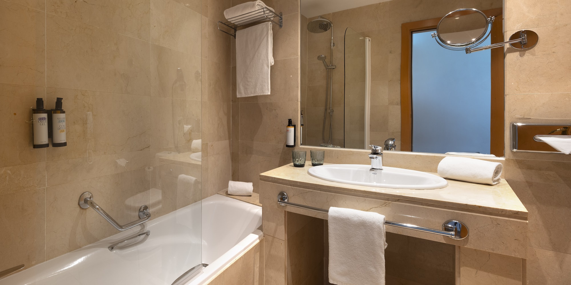 a bathroom with a bathtub and sink