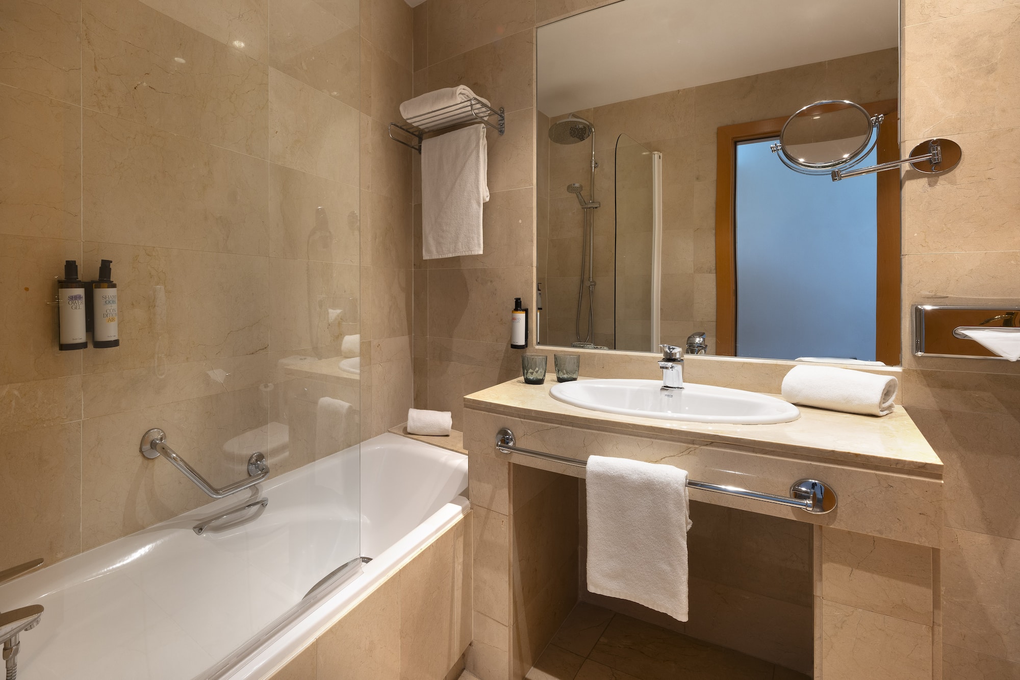 a bathroom with a bathtub and sink