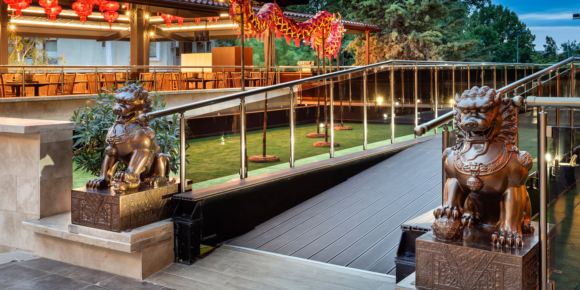 a building with a staircase and statues of lions