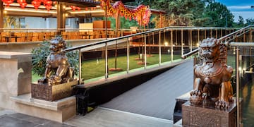 a building with a staircase and statues of lions