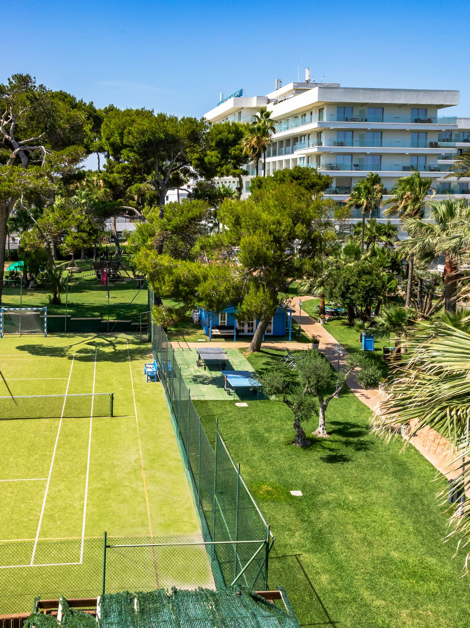 a tennis court and trees