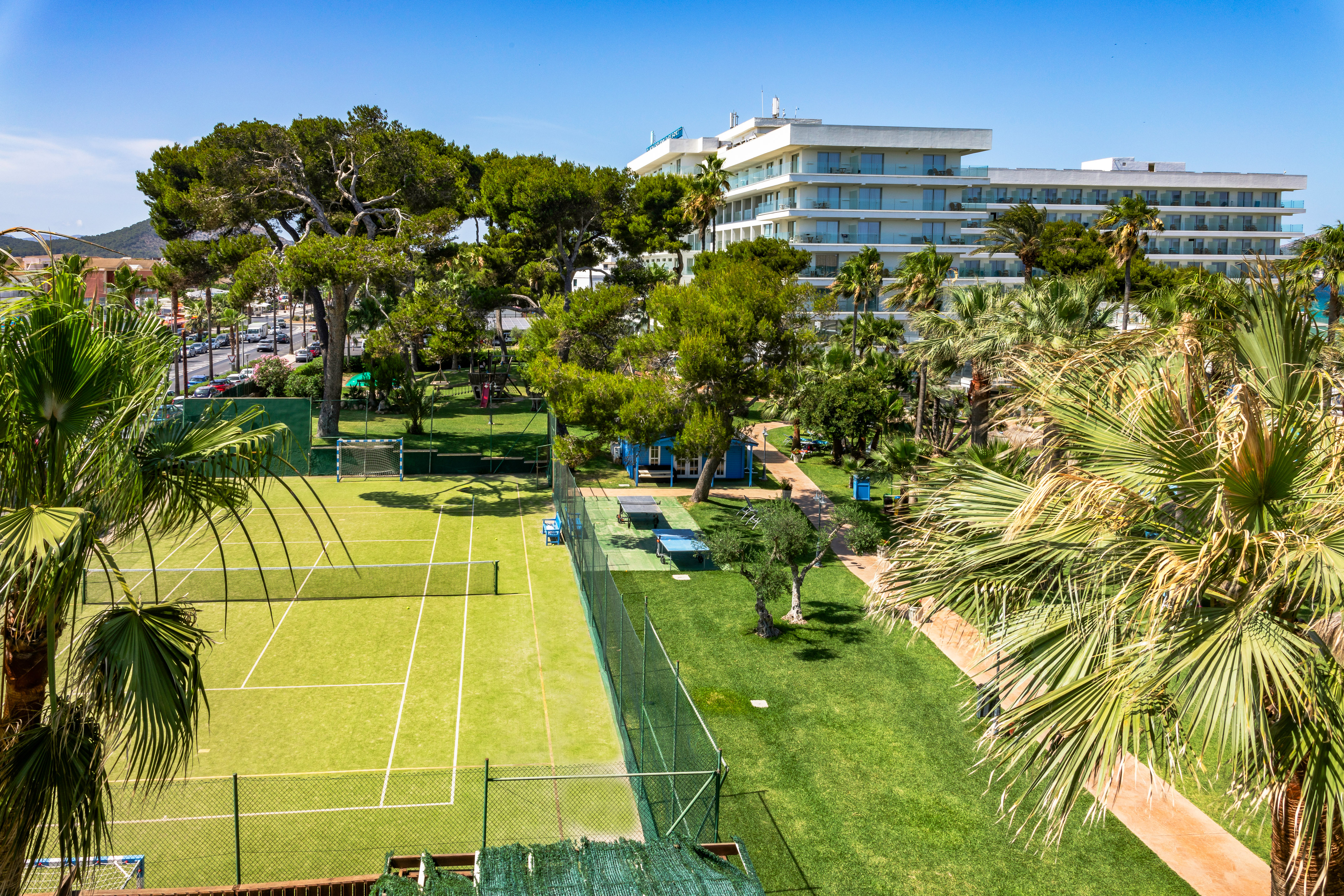 a tennis court and trees