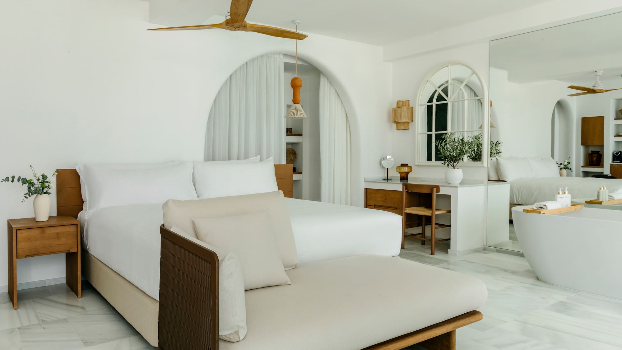 a bedroom with a bed and a desk