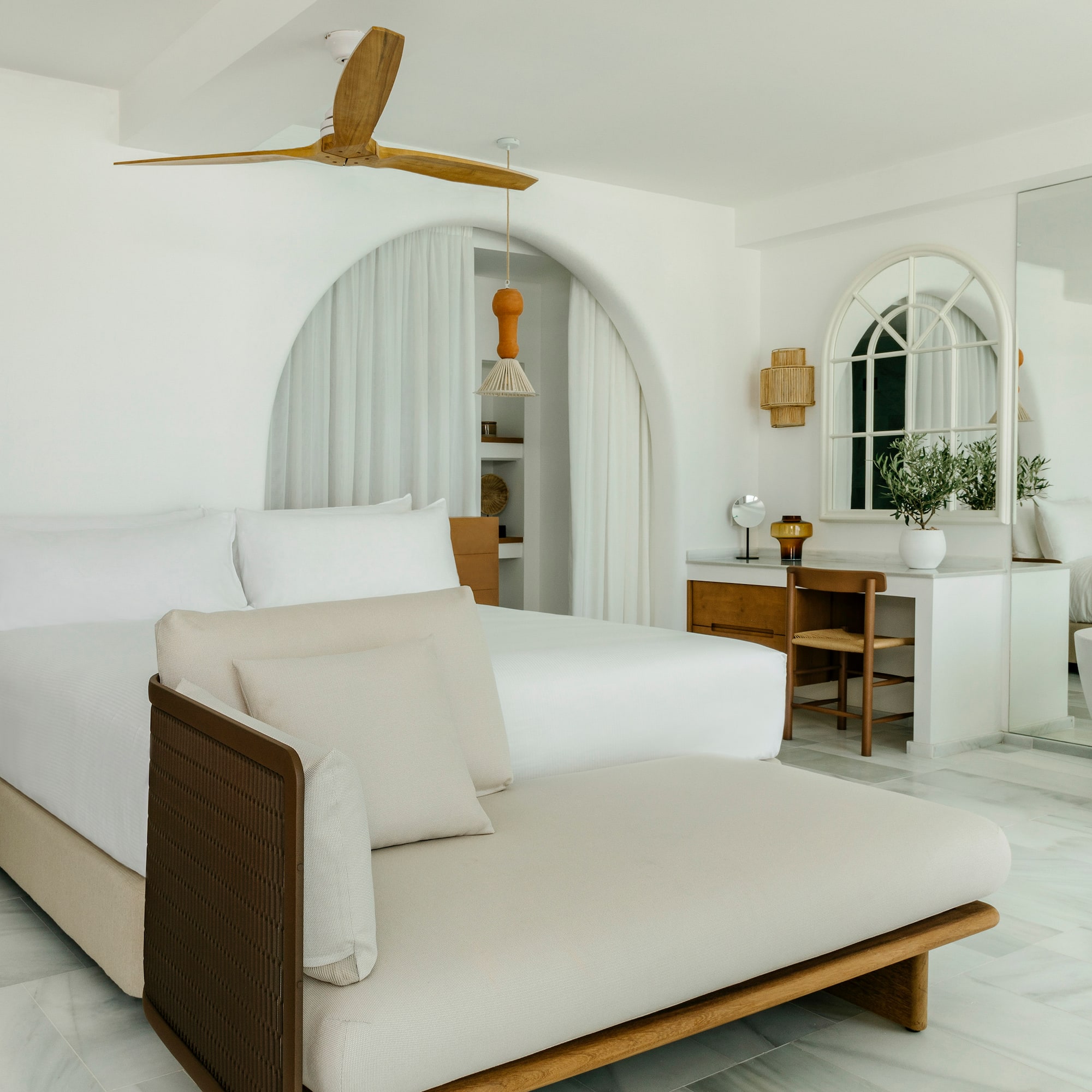 a bedroom with a bed and a desk