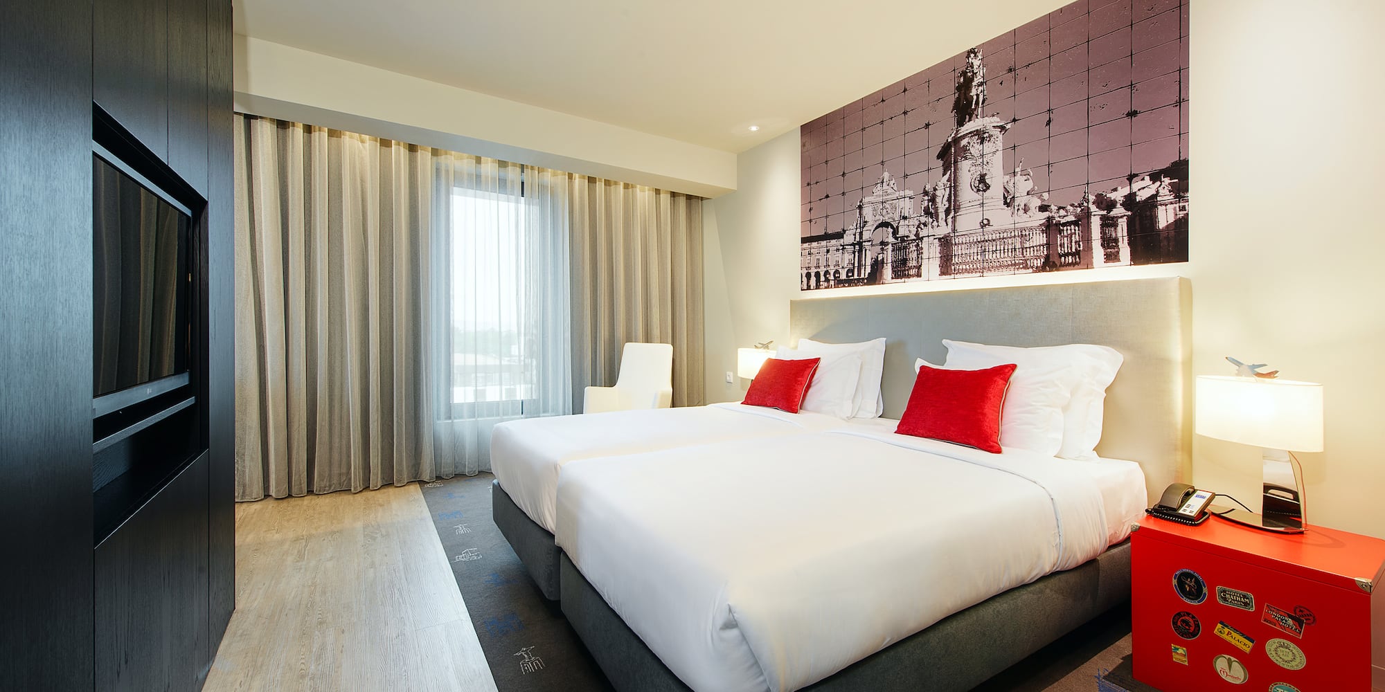 a room with a bed and a picture on the wall