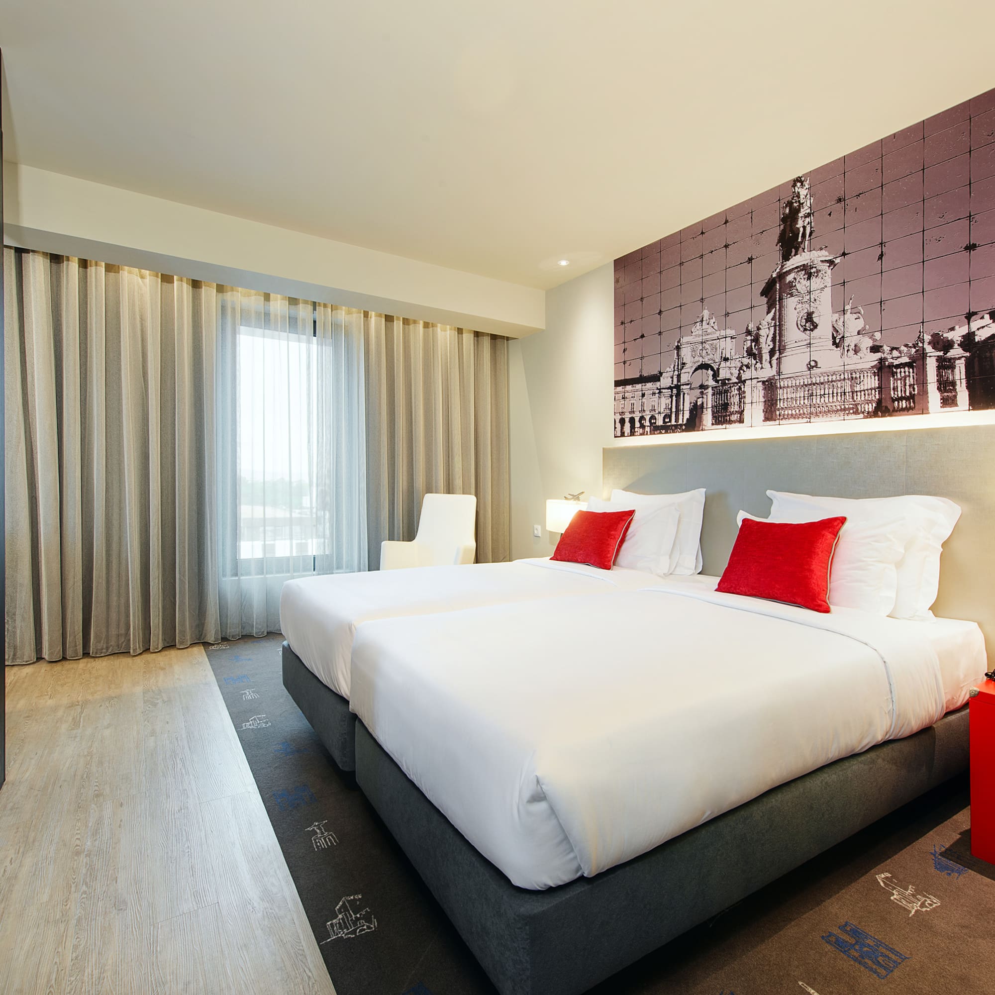 a room with a bed and a picture on the wall