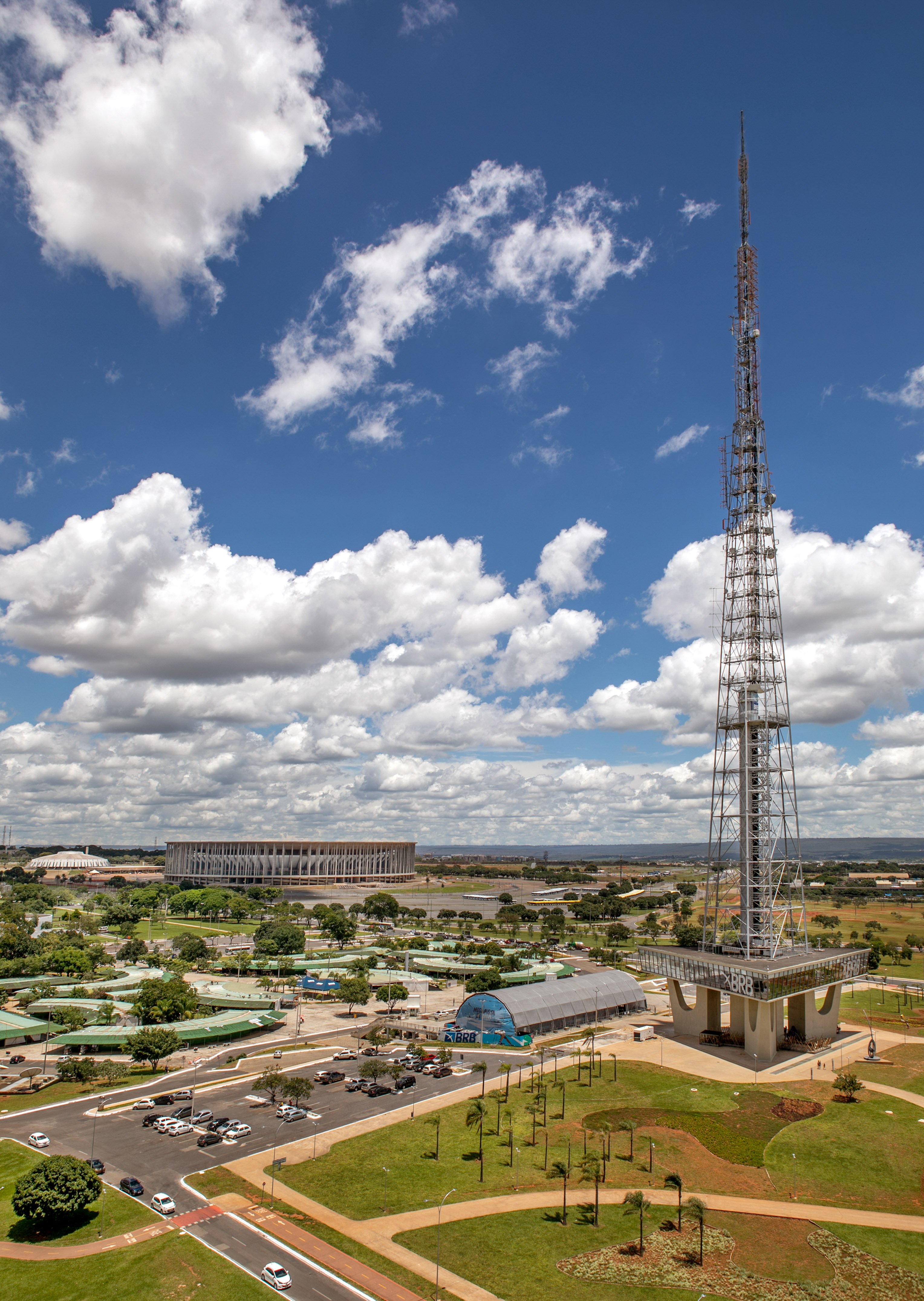 Brasilia TV Tower and National Stadium against a blue, cloudy sky.