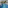 Outdoor hotel pool featuring MIM logo, white lounge chairs, palm trees, and resort buildings.