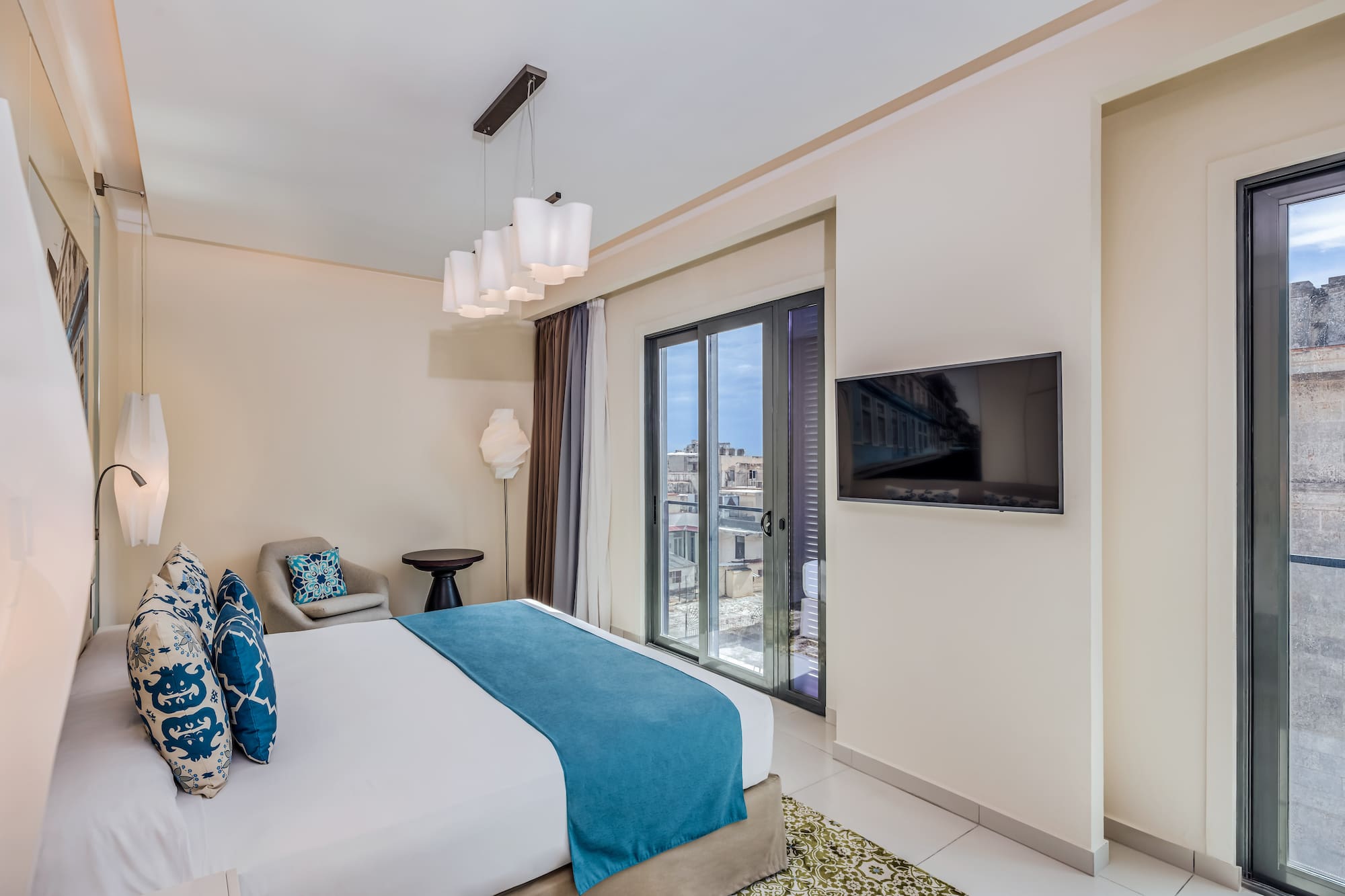 a bedroom with a bed and a television