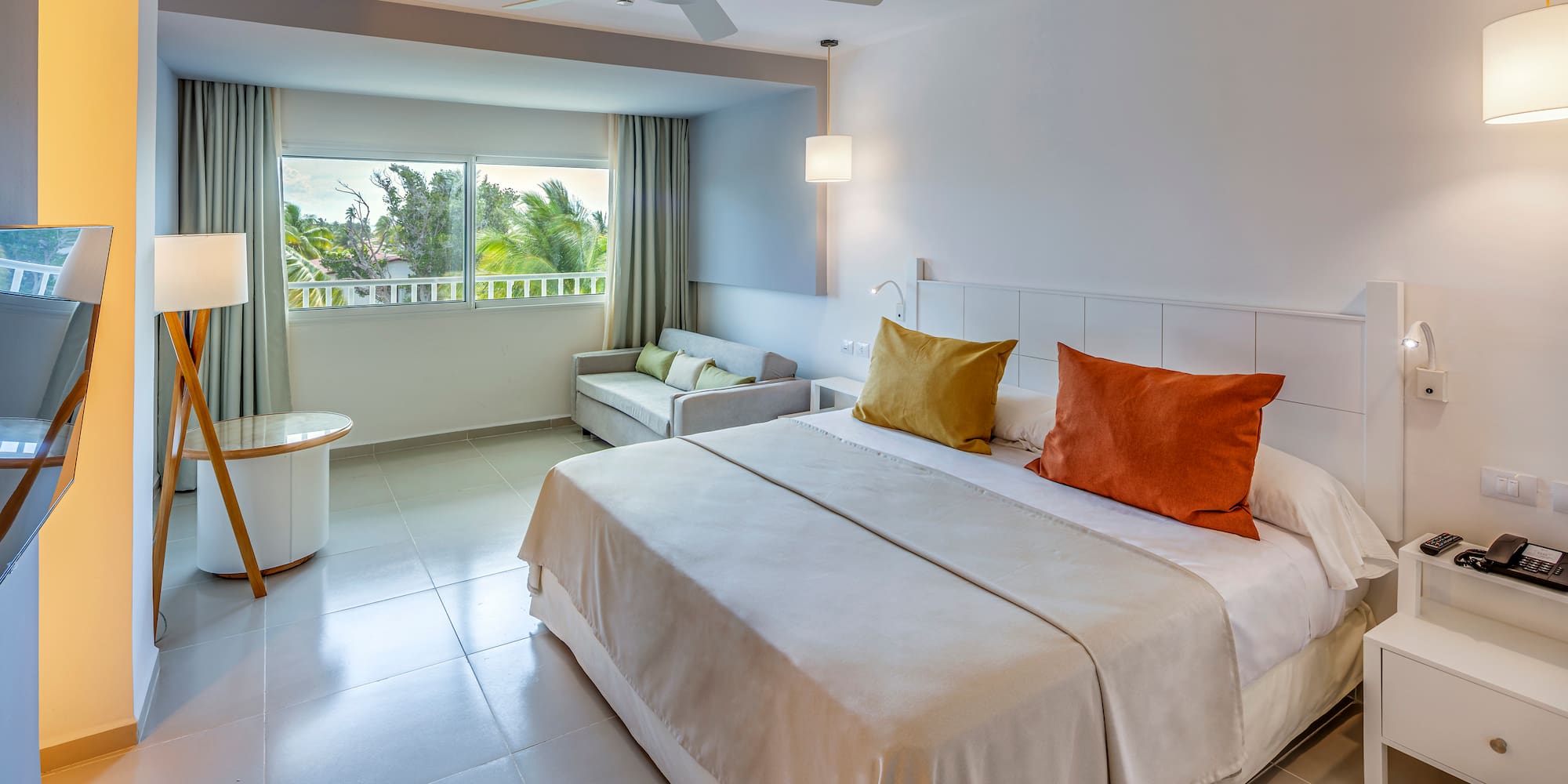 a bedroom with a bed and a ceiling fan