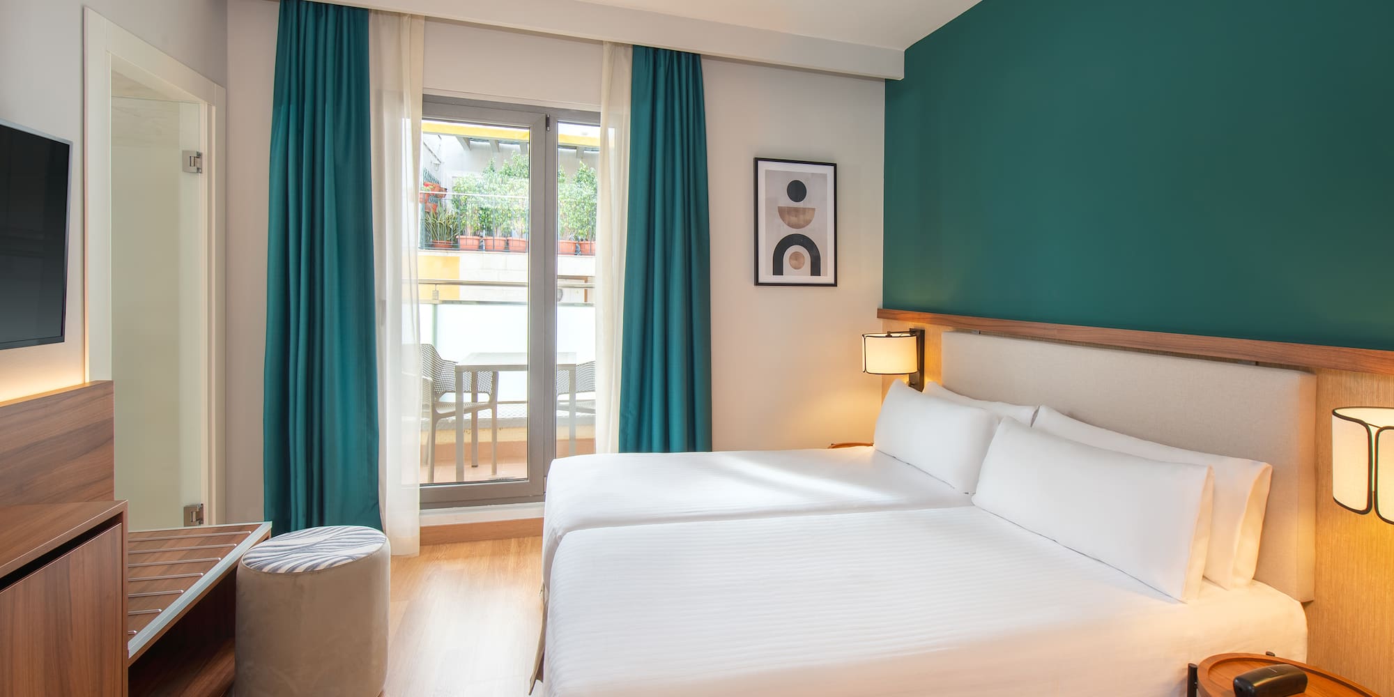 a room with two beds and a table